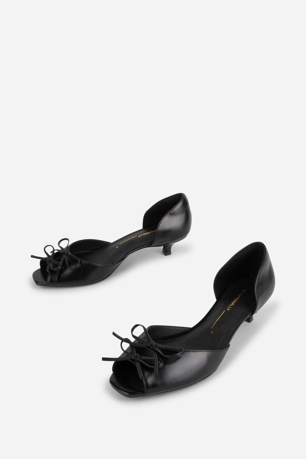 "INTENTIONALLY __________." Carol Peep Toe Kitten Heel