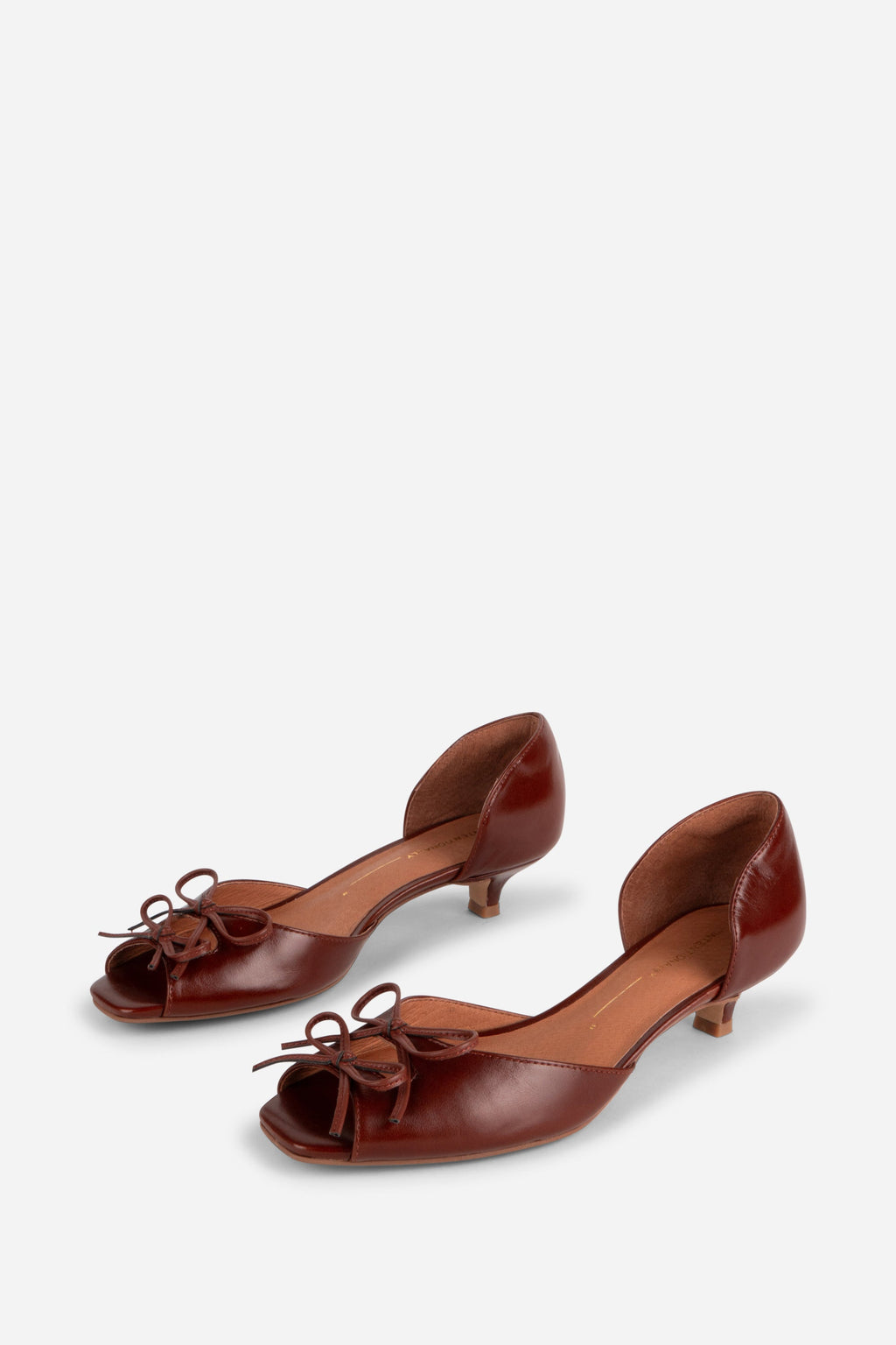 "INTENTIONALLY __________." Carol Peep Toe Kitten Heel