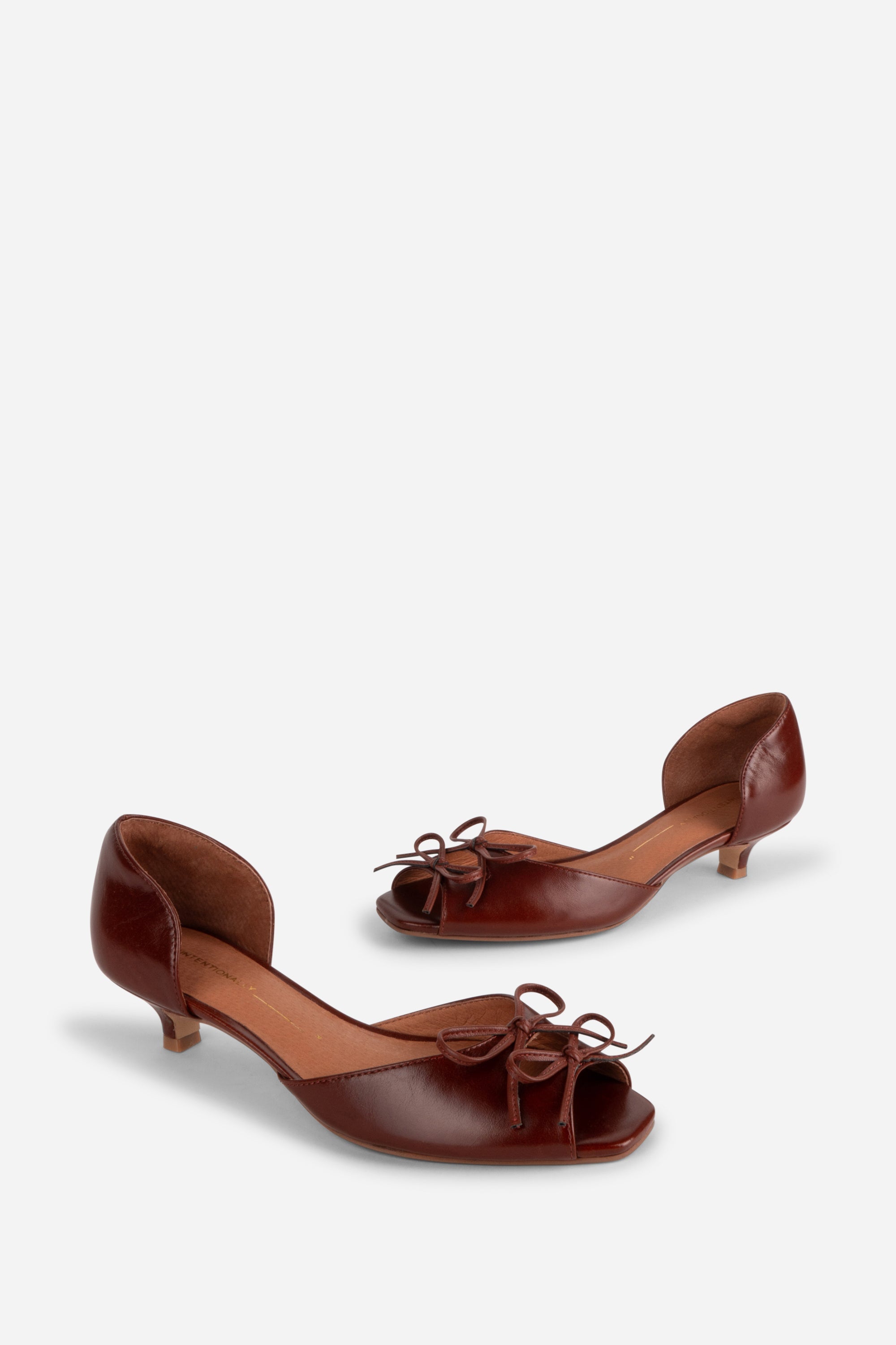 "INTENTIONALLY __________." Carol Peep Toe Kitten Heel