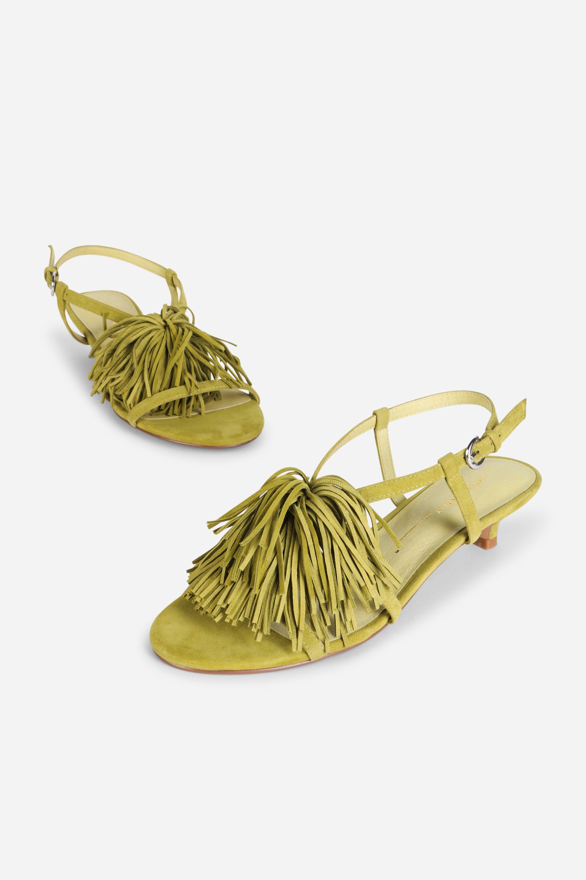 INTENTIONALLY __________. Chaperone Fringe Kitten Heel Sandals