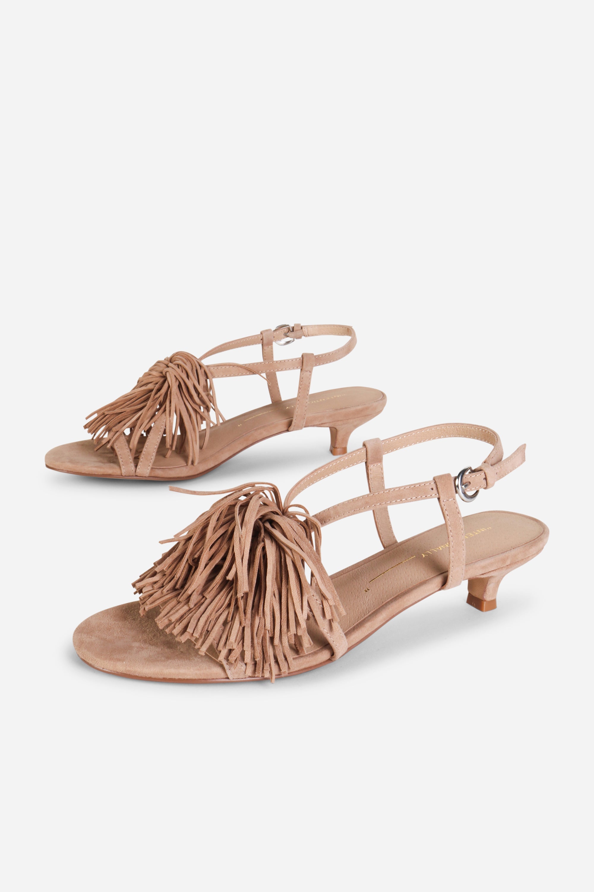 INTENTIONALLY __________. Chaperone Fringe Kitten Heel Sandals