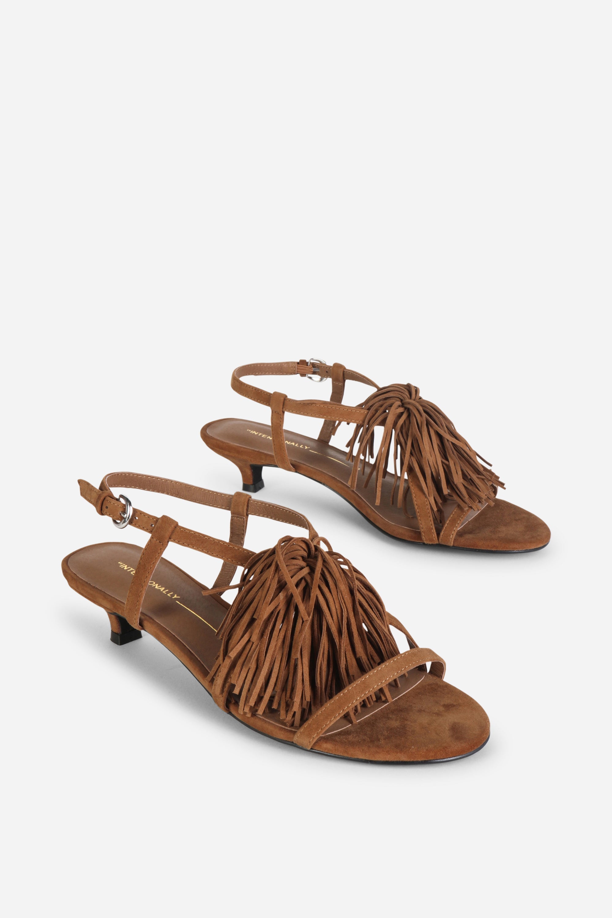 INTENTIONALLY __________. Chaperone Fringe Kitten Heel Sandals