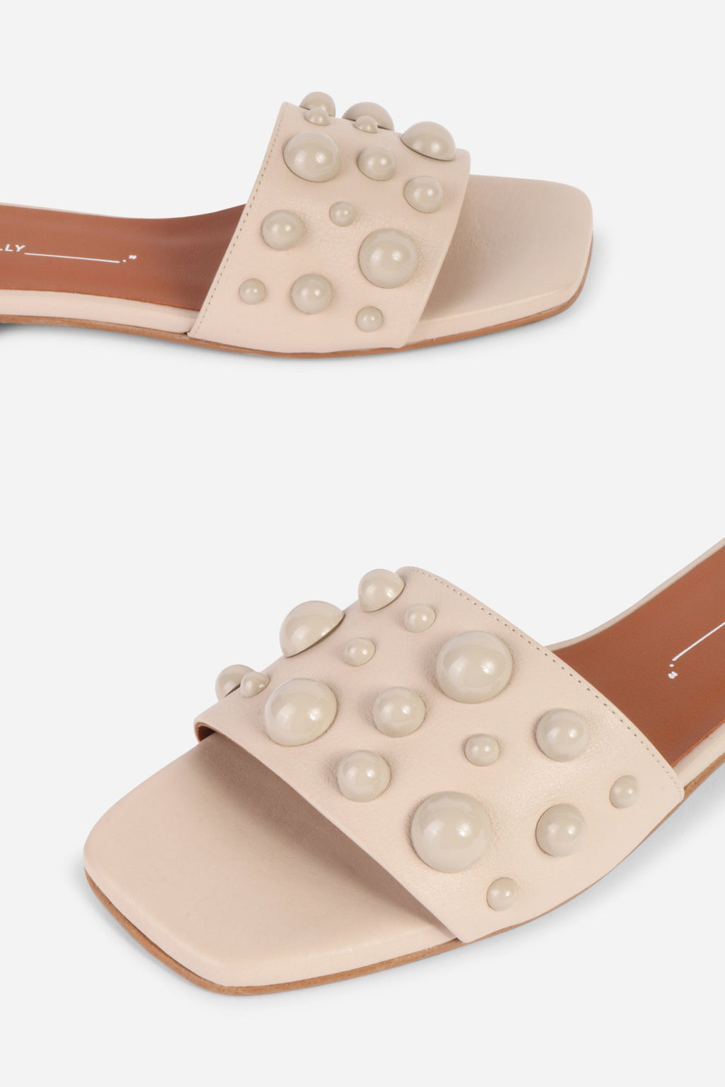 INTENTIONALLY __________. Cocktail Leather Slide