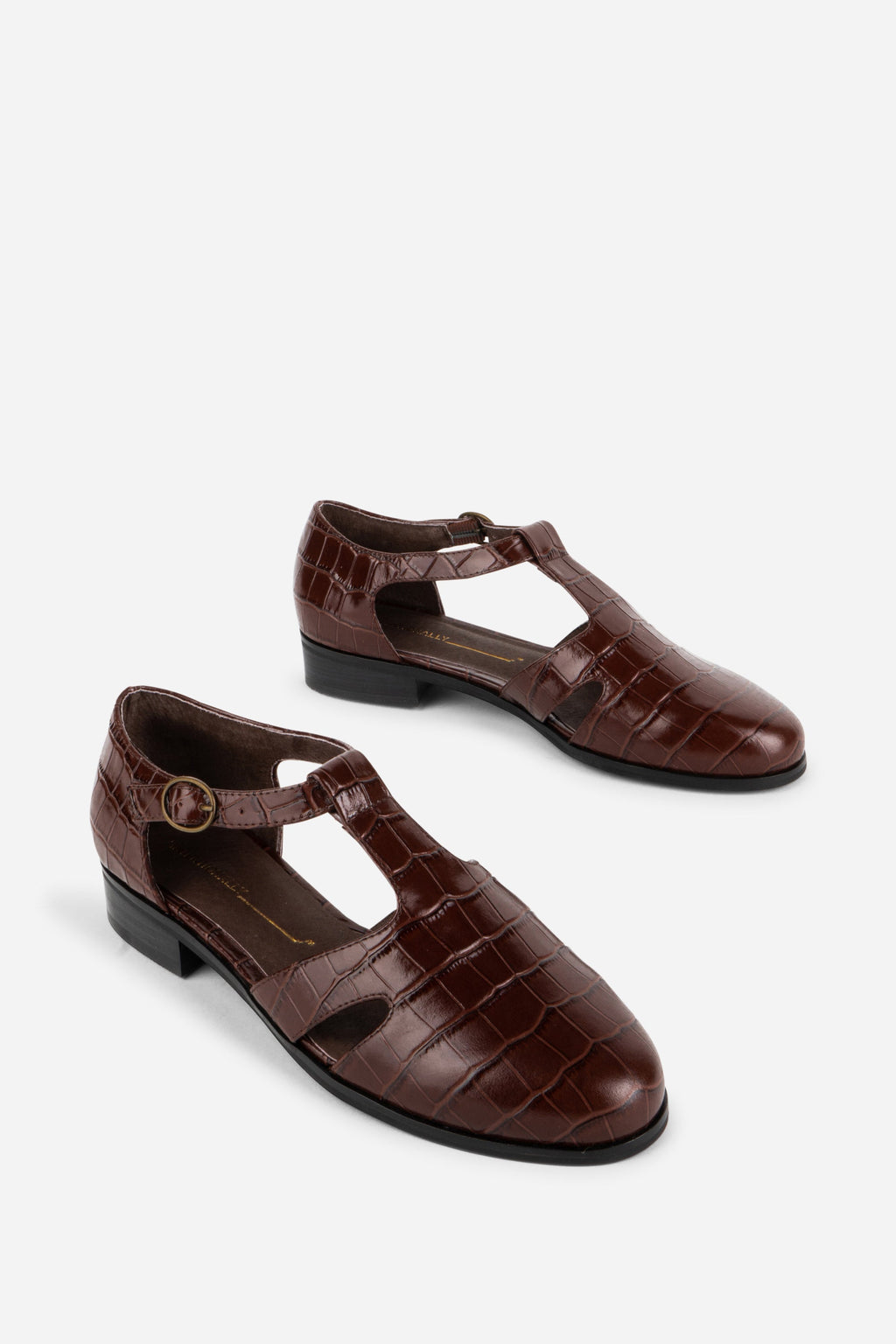 INTENTIONALLY __________. Eureka T-Strap Flat