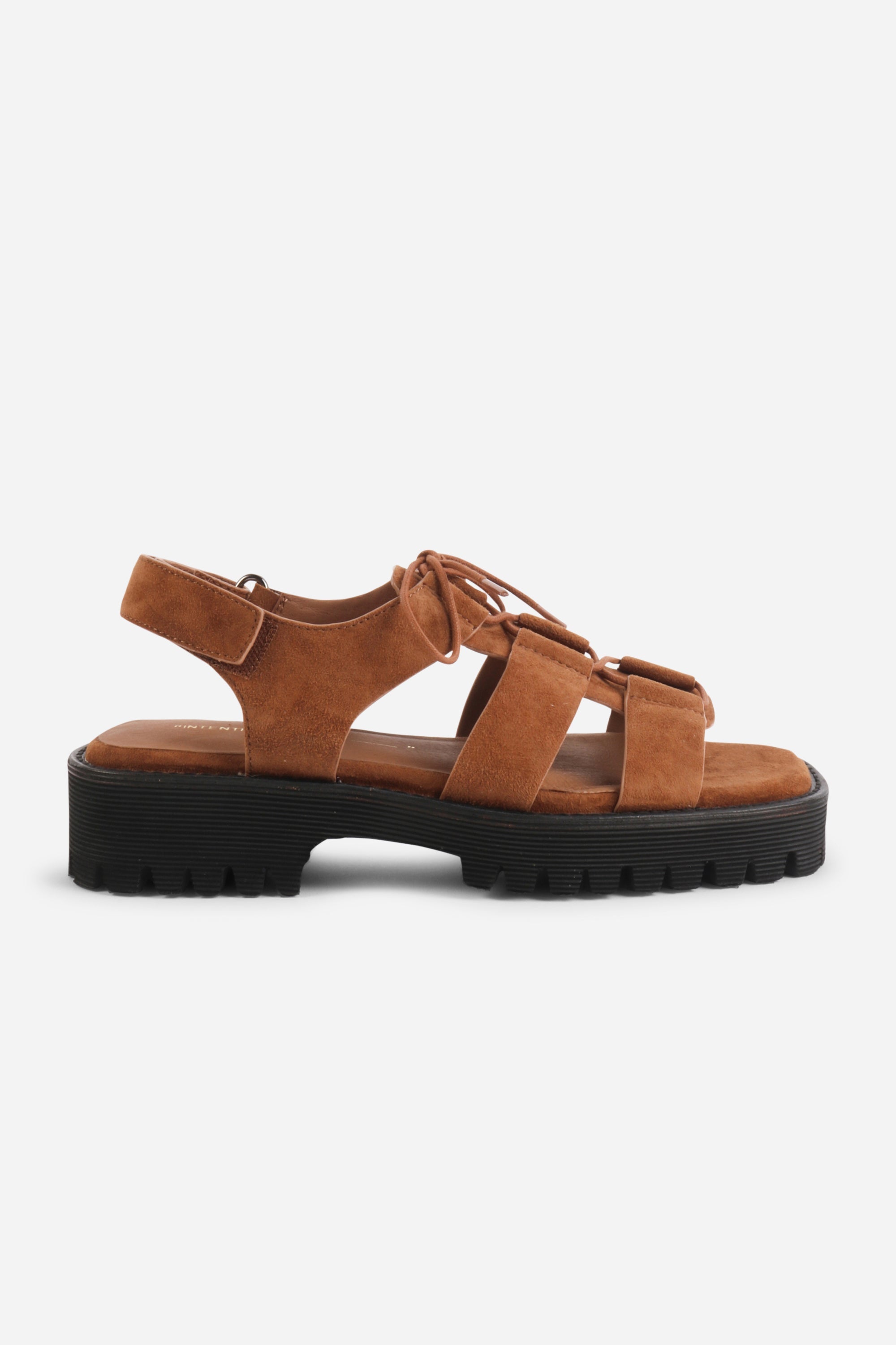 INTENTIONALLY __________. Hampton Flat Sandal