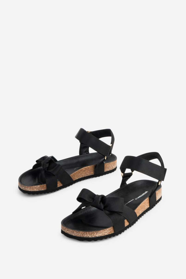 "INTENTIONALLY __________." Hoops Sandal