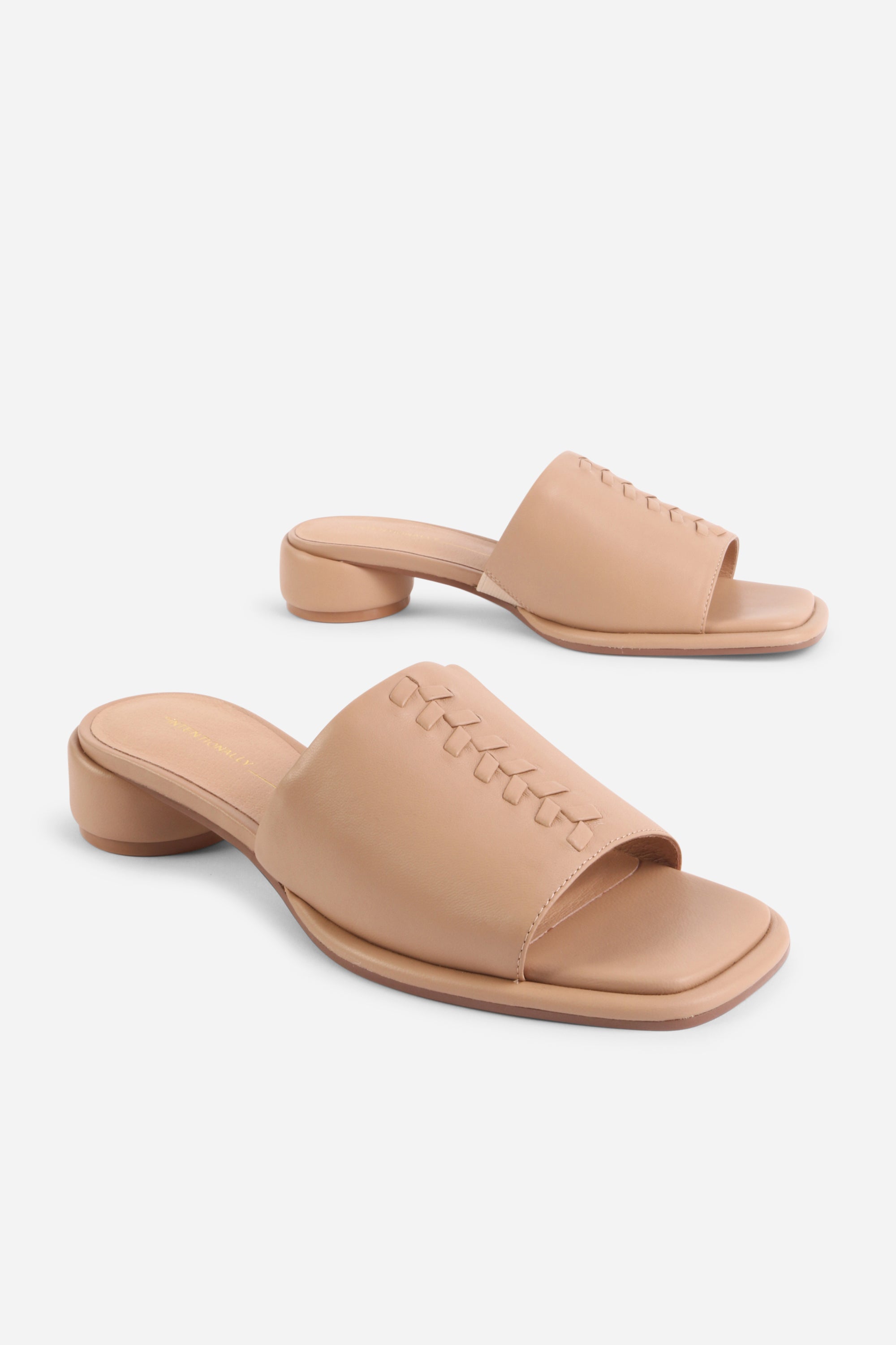 INTENTIONALLY __________. Imagine Leather Slide