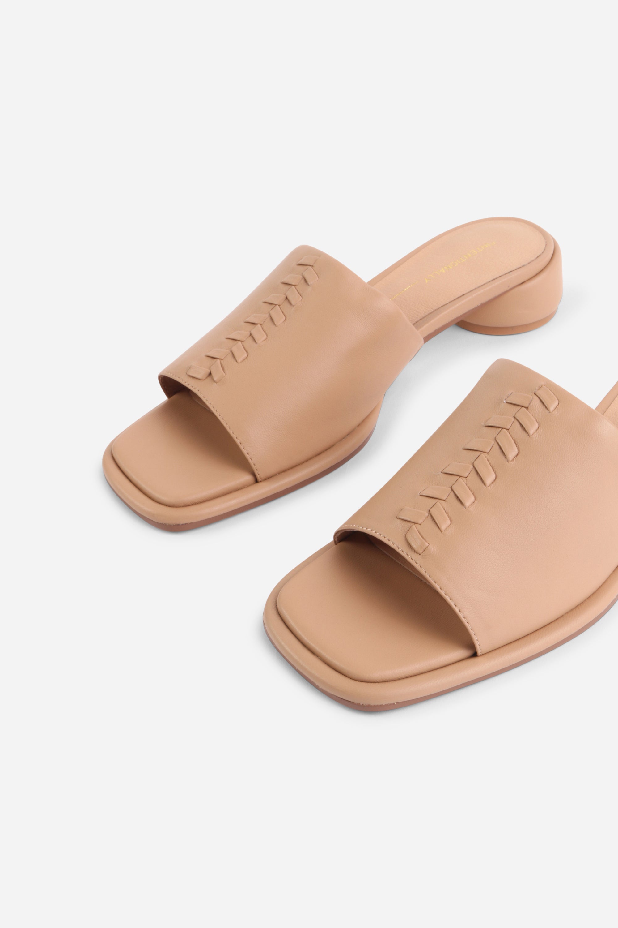 INTENTIONALLY __________. Imagine Leather Slide