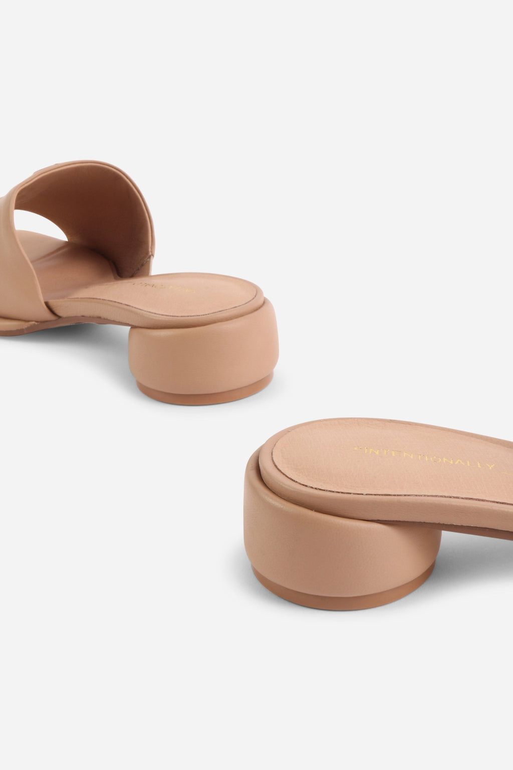 INTENTIONALLY __________. Imagine Leather Slide