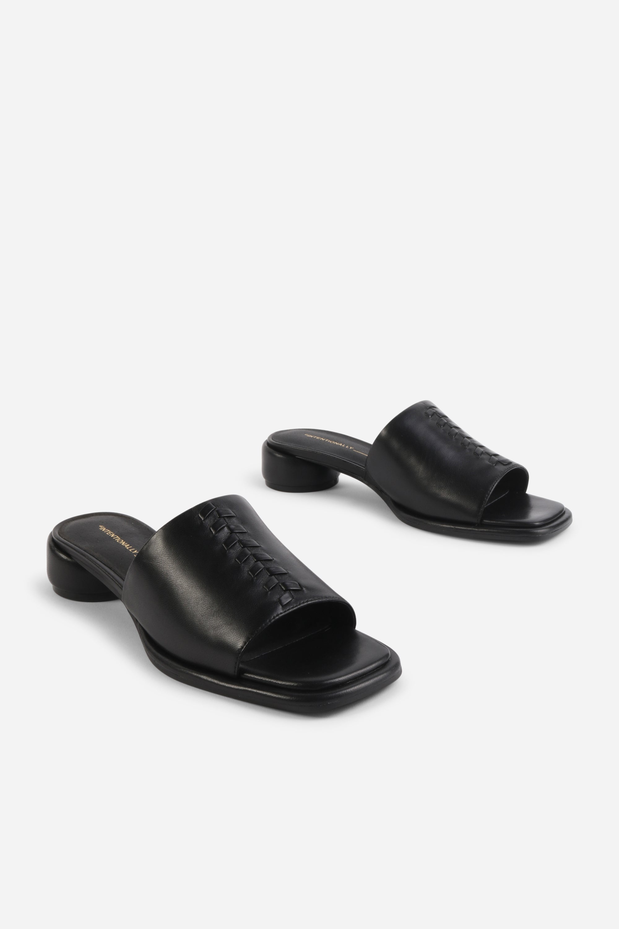 INTENTIONALLY __________. Imagine Leather Slide