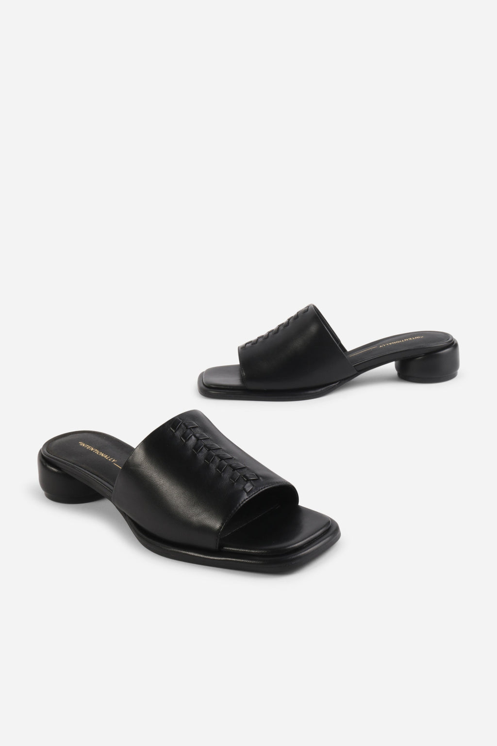 INTENTIONALLY __________. Imagine Leather Slide