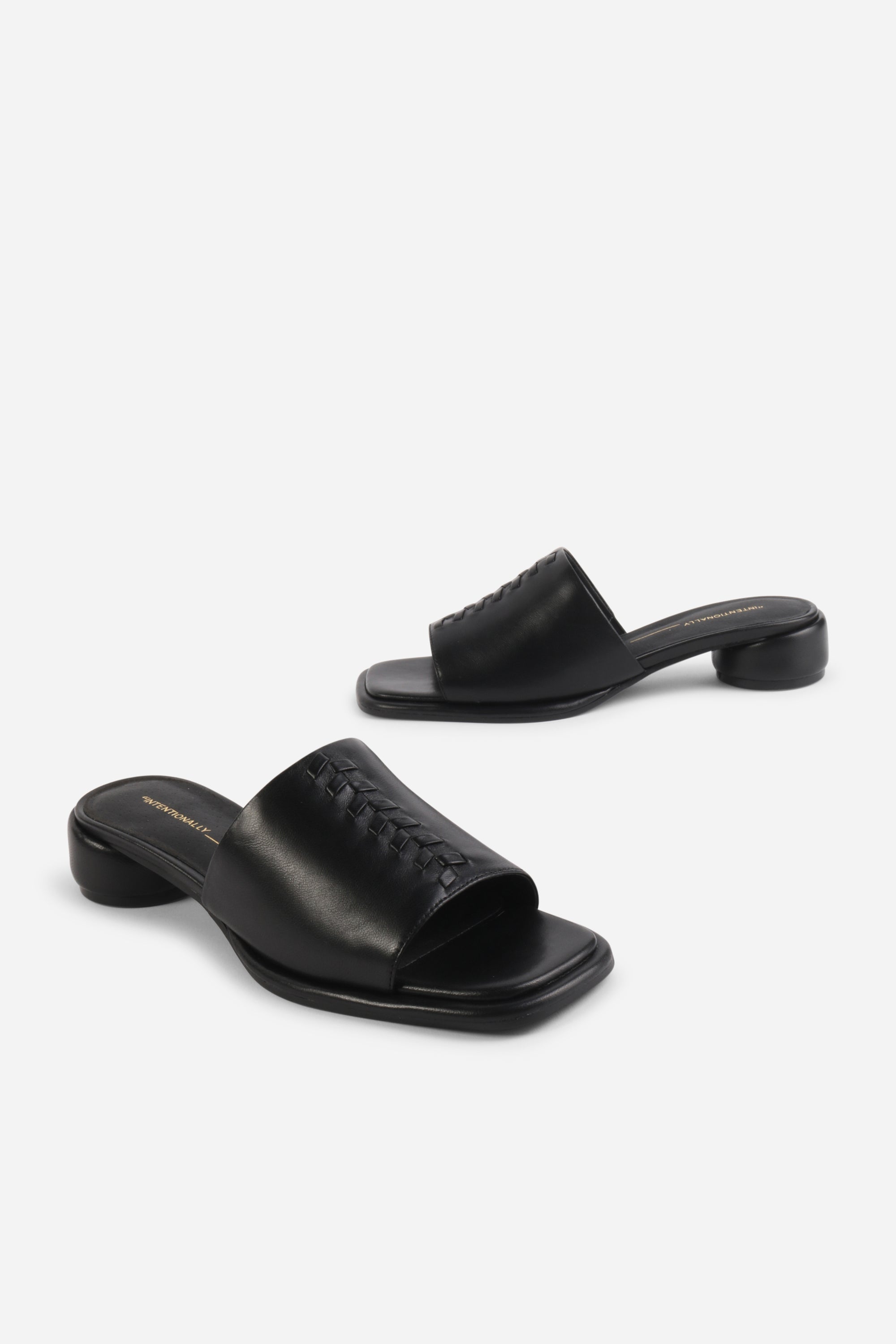 INTENTIONALLY __________. Imagine Leather Slide