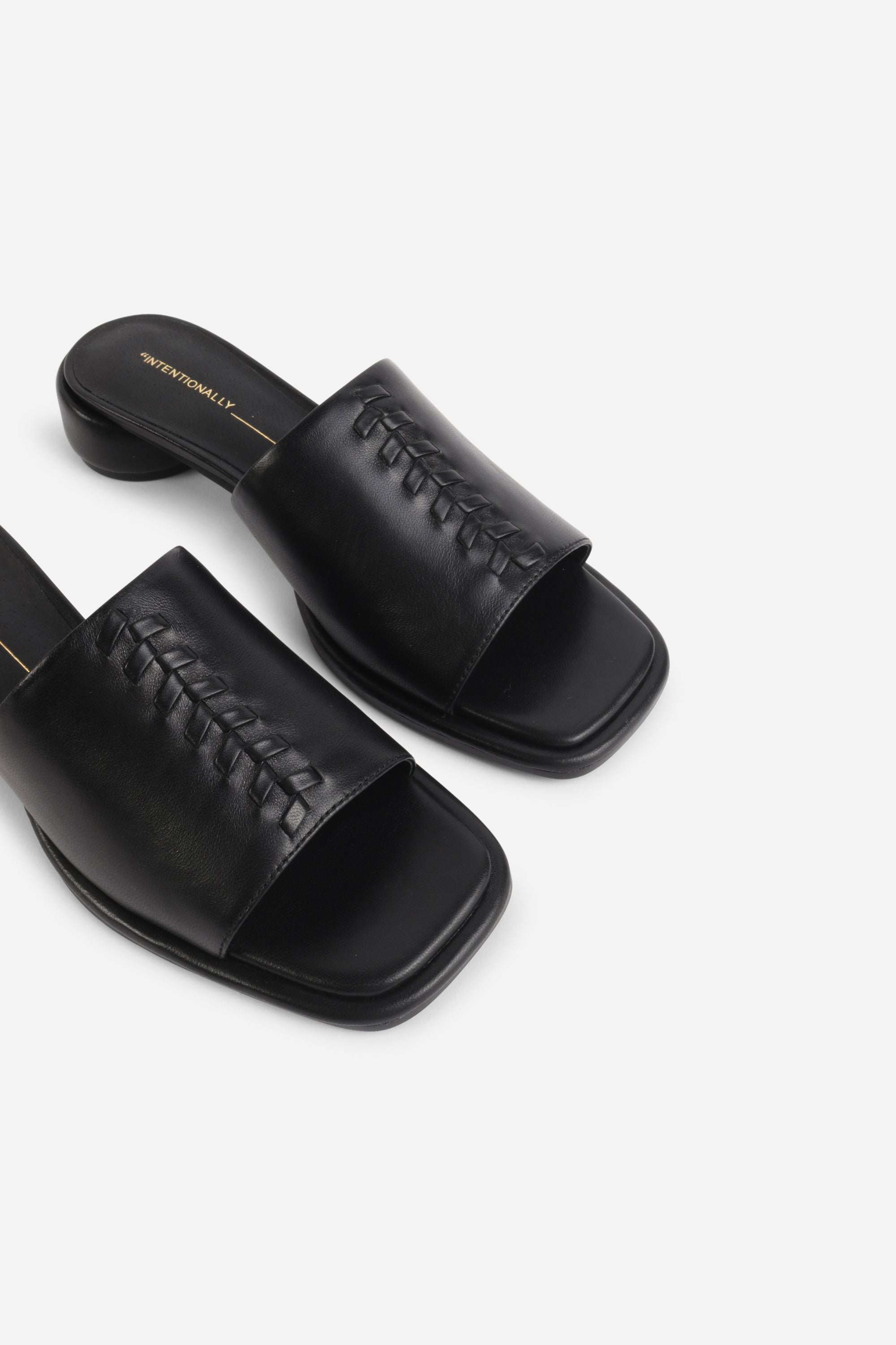 INTENTIONALLY __________. Imagine Leather Slide