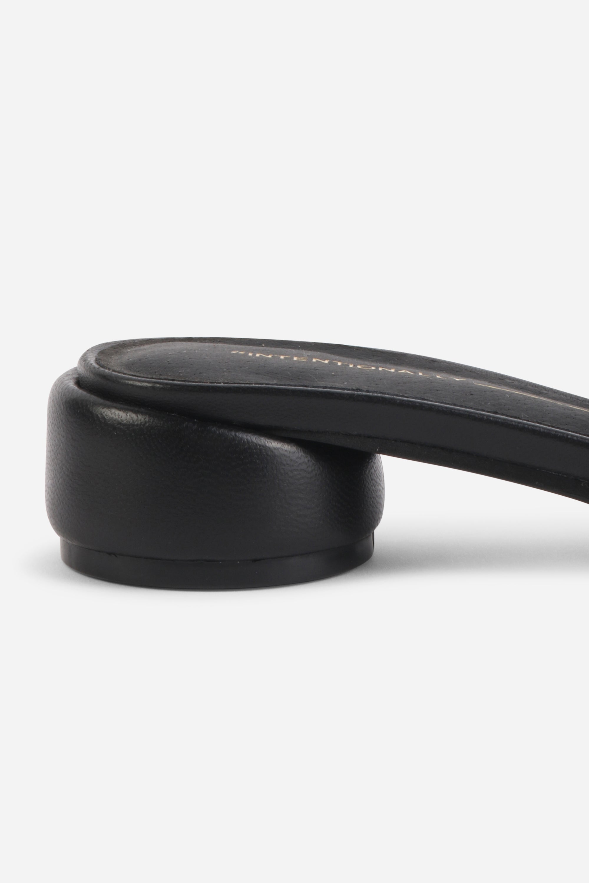 INTENTIONALLY __________. Imagine Leather Slide