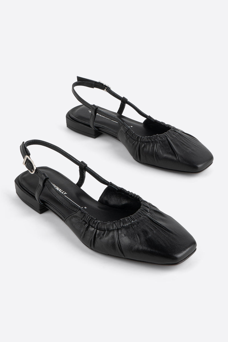 "INTENTIONALLY __________." DAFF SLINGBACK FLAT - Black/Cream