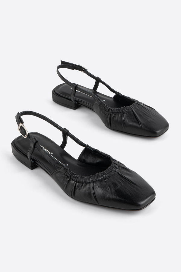 "INTENTIONALLY __________." DAFF SLINGBACK FLAT - Black/Cream