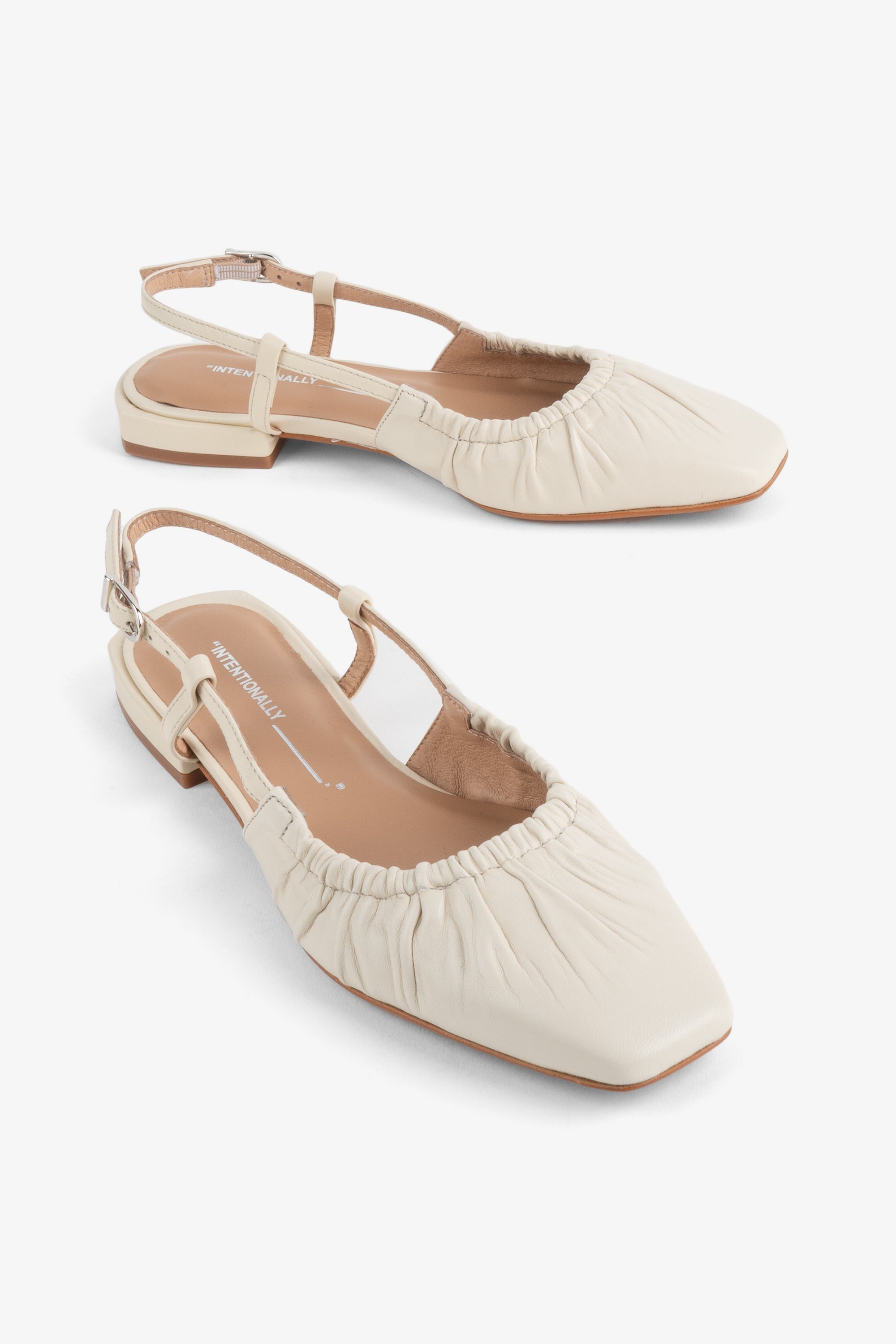 "INTENTIONALLY __________." DAFF SLINGBACK FLAT - Black/Cream