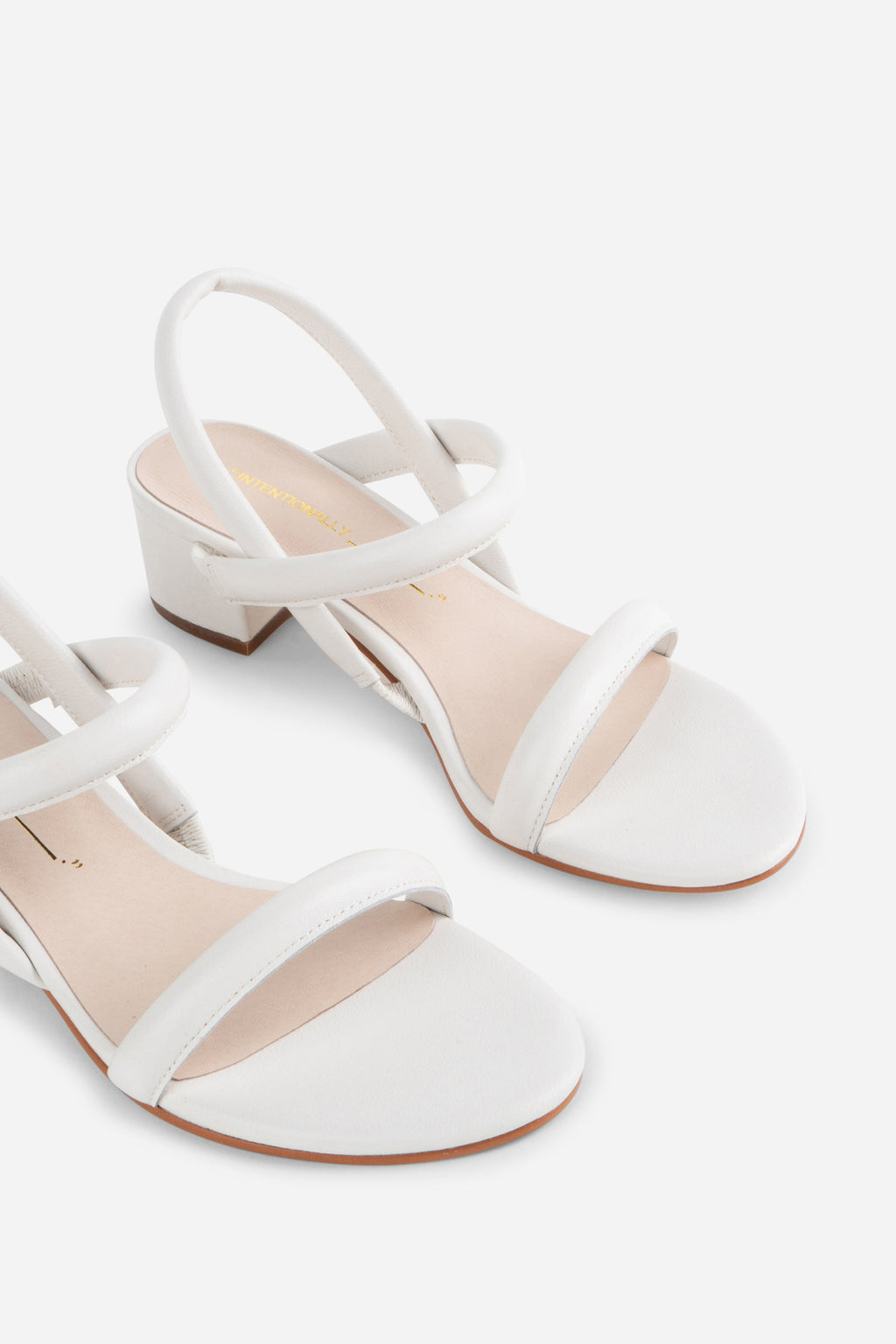 "INTENTIONALLY __________." KIMI HEEL - black