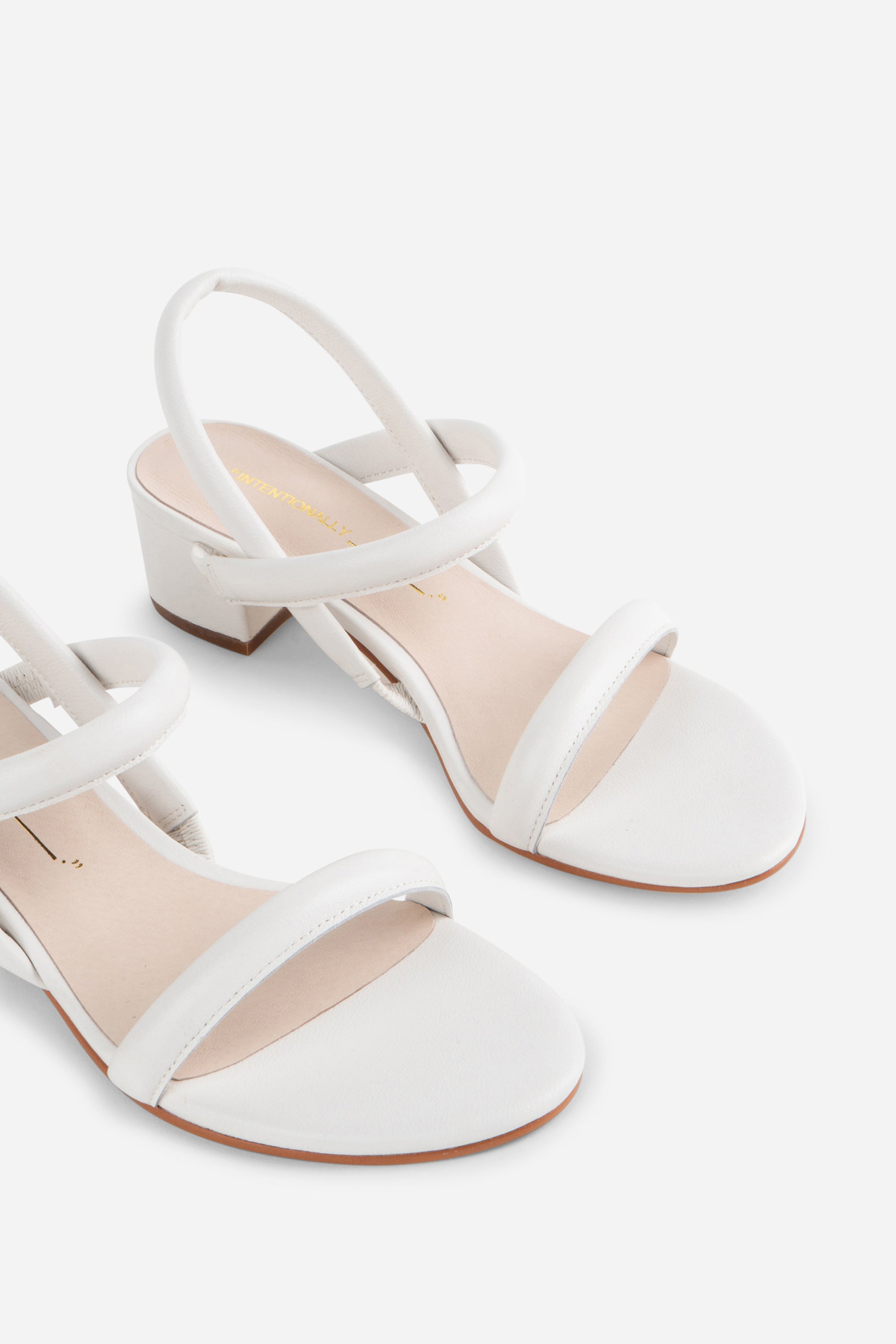 "INTENTIONALLY __________." KIMI HEEL - black