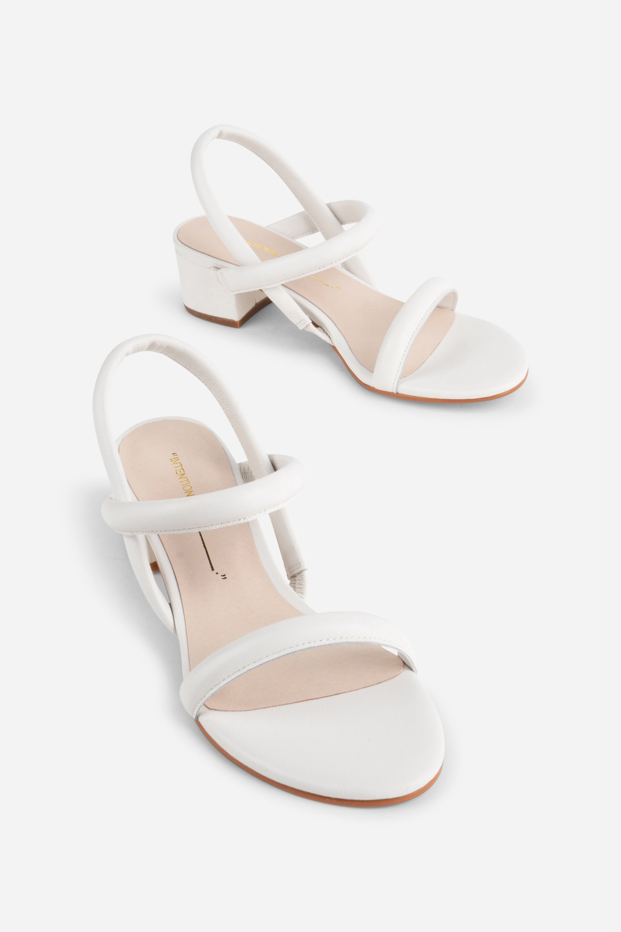 "INTENTIONALLY __________." KIMI HEEL - black