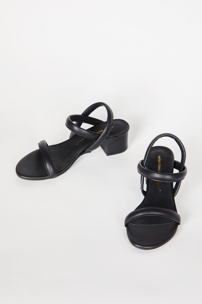 "INTENTIONALLY __________." KIMI HEEL - black