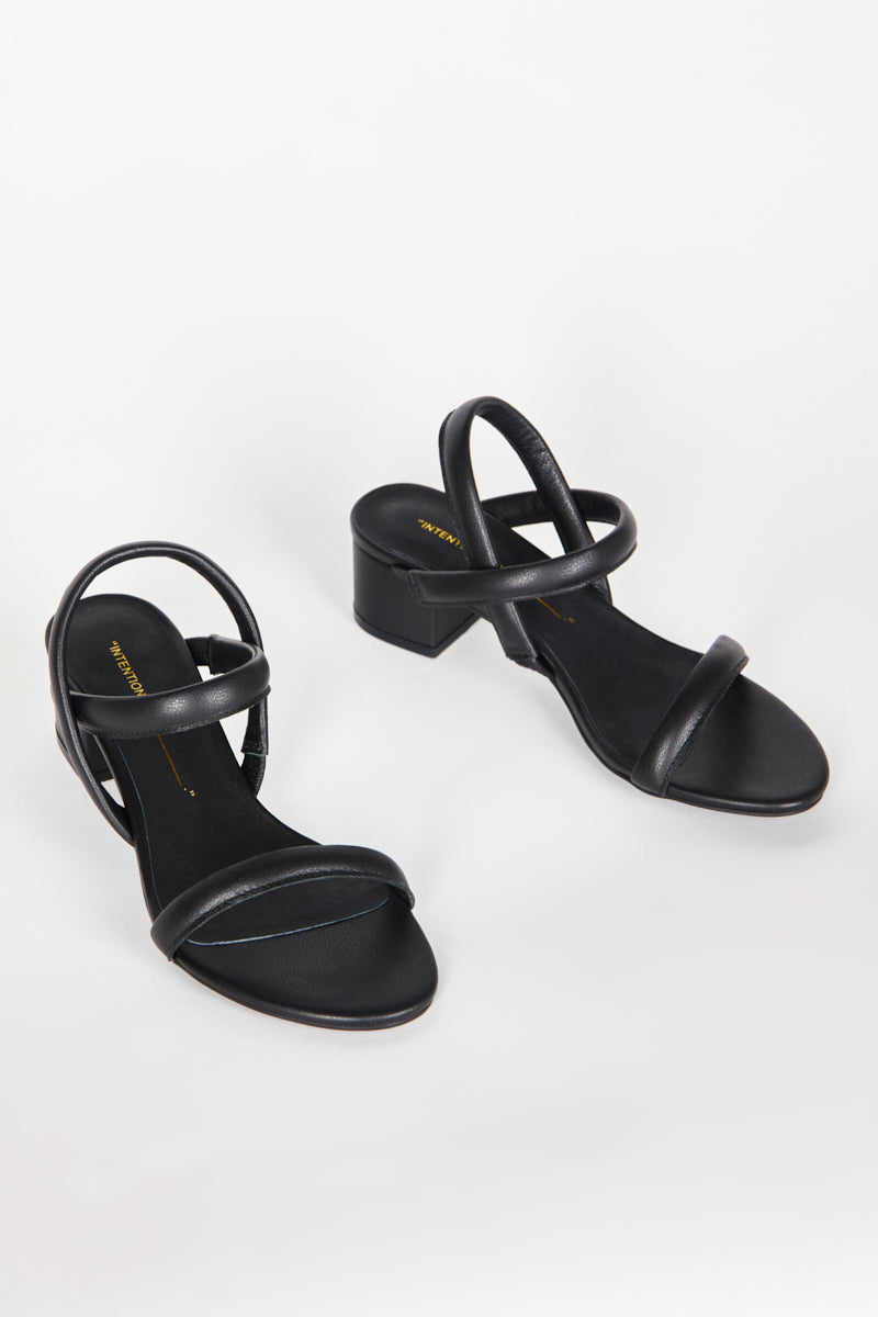 "INTENTIONALLY __________." KIMI HEEL - black