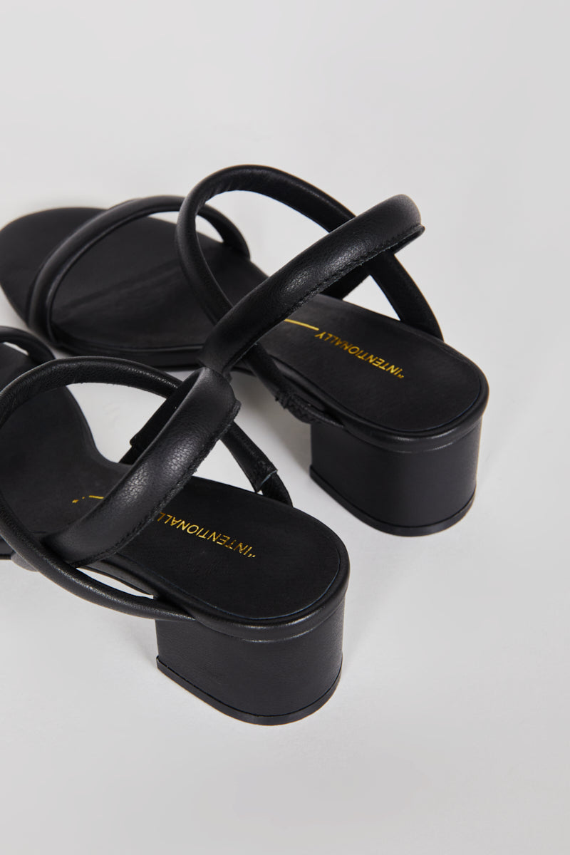 "INTENTIONALLY __________." KIMI HEEL - black