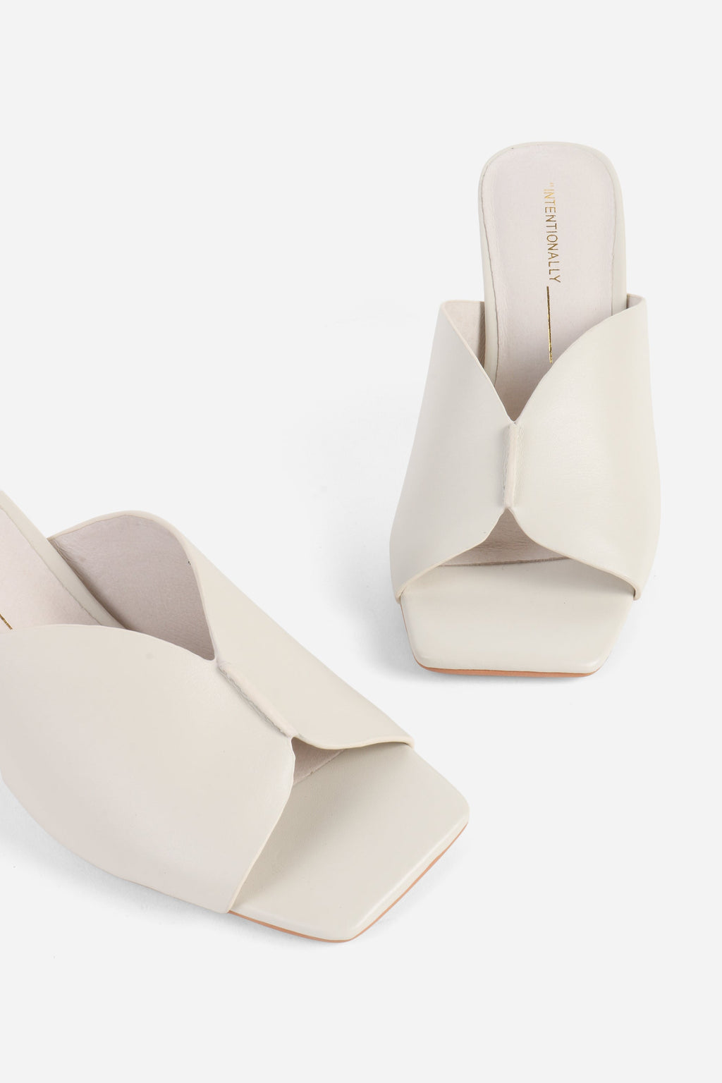 "INTENTIONALLY __________." Kamika Heel - Multi