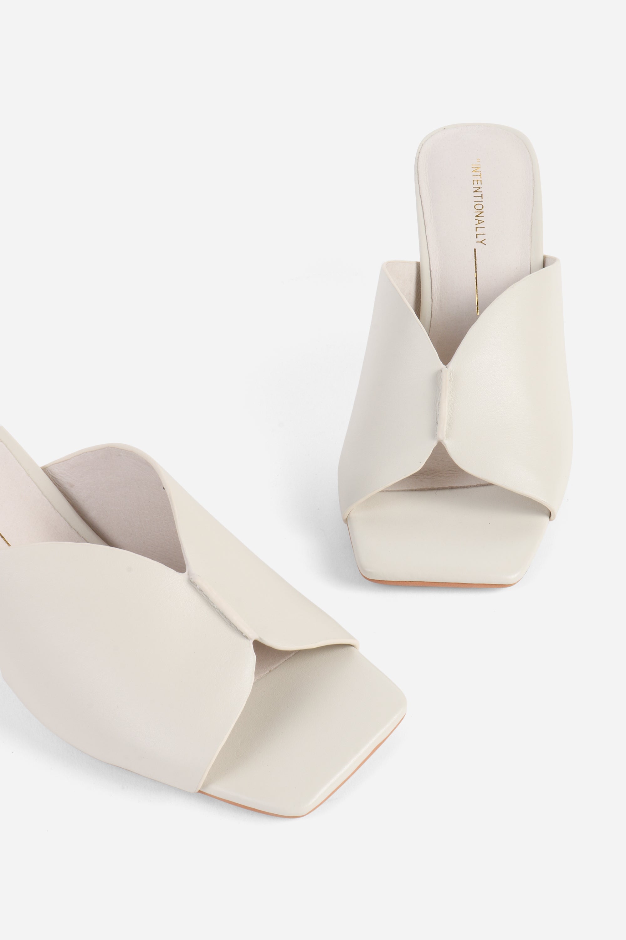 "INTENTIONALLY __________." Kamika Heel - Multi