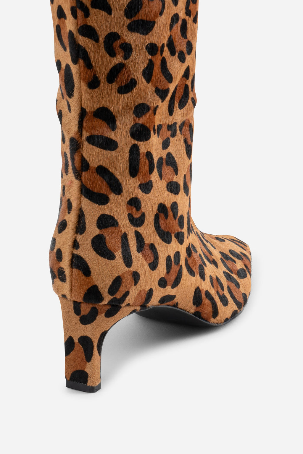 "INTENTIONALLY __________." Seville Knee High Boot - Cheetah