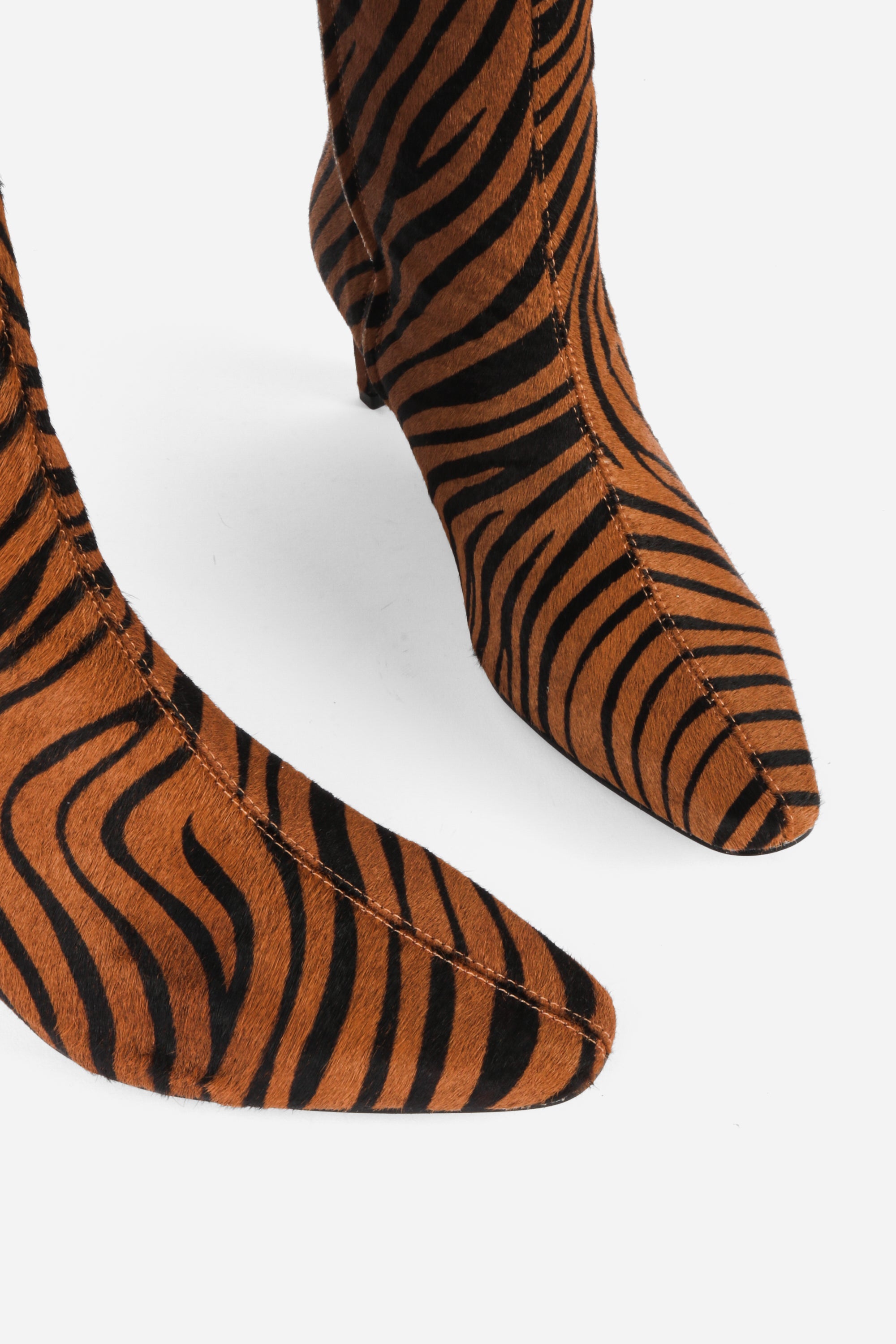 "INTENTIONALLY __________." Seville Knee High Boot - Cheetah