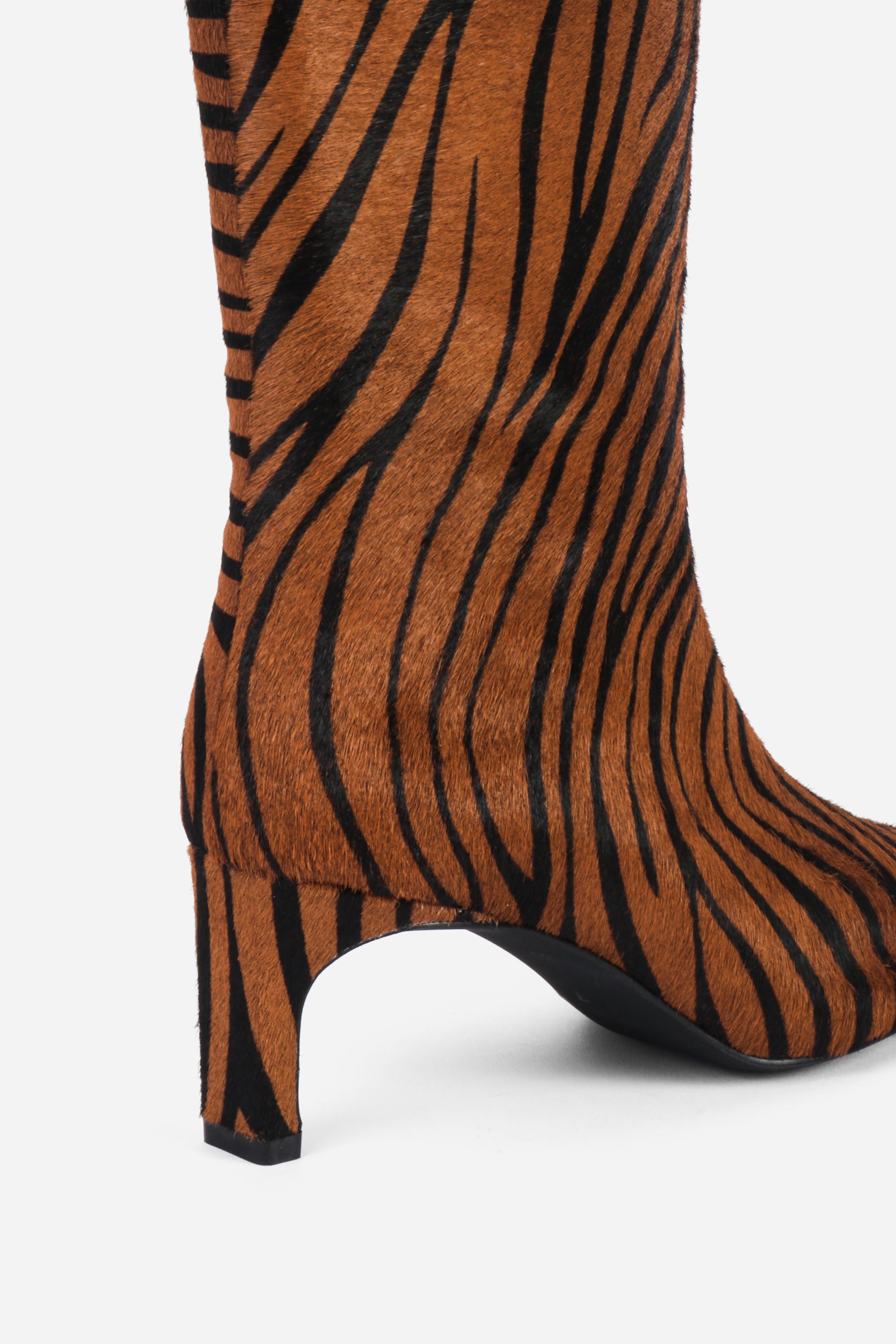 "INTENTIONALLY __________." Seville Knee High Boot - Cheetah
