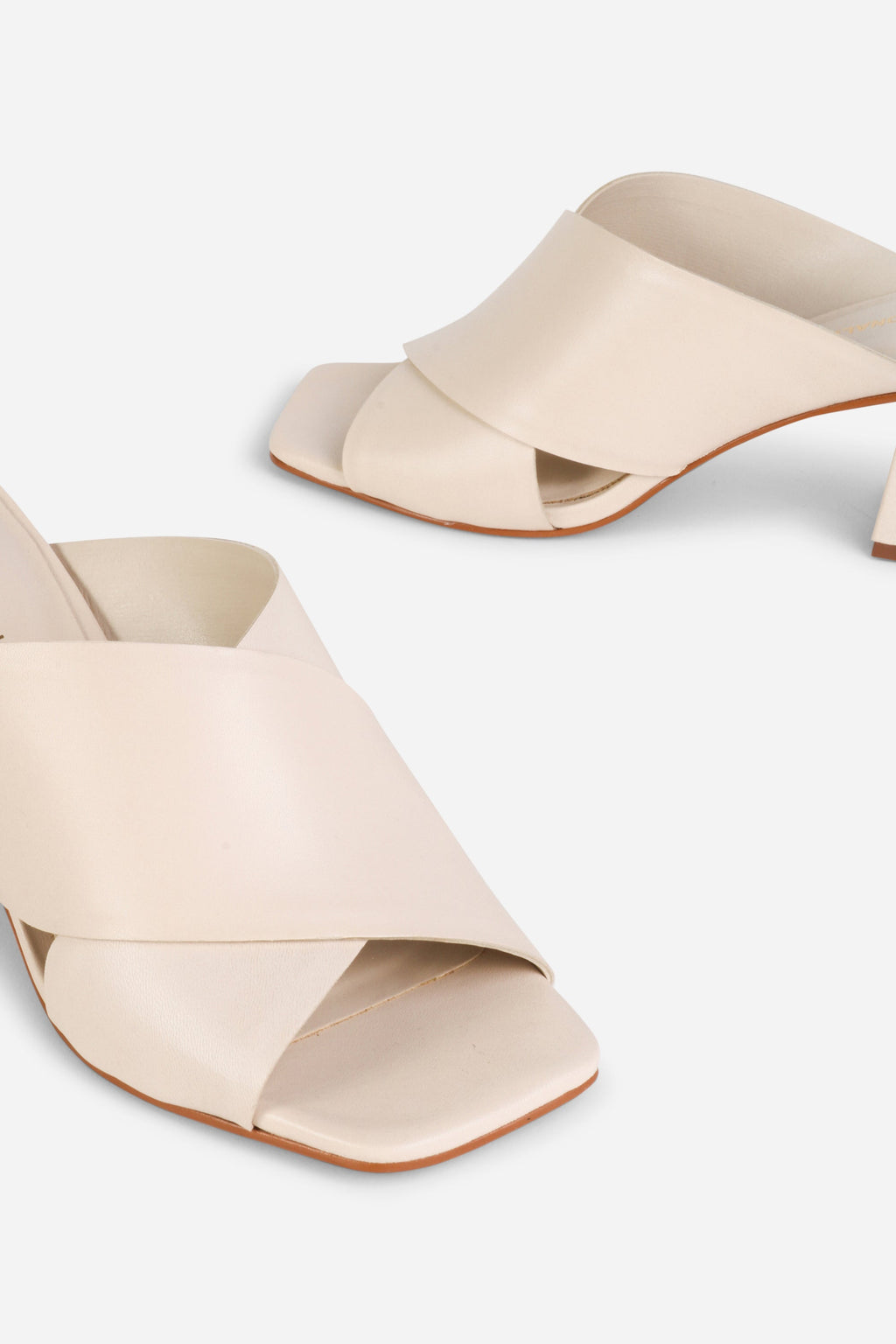 INTENTIONALLY __________. Lefty Mule Heel Sandals