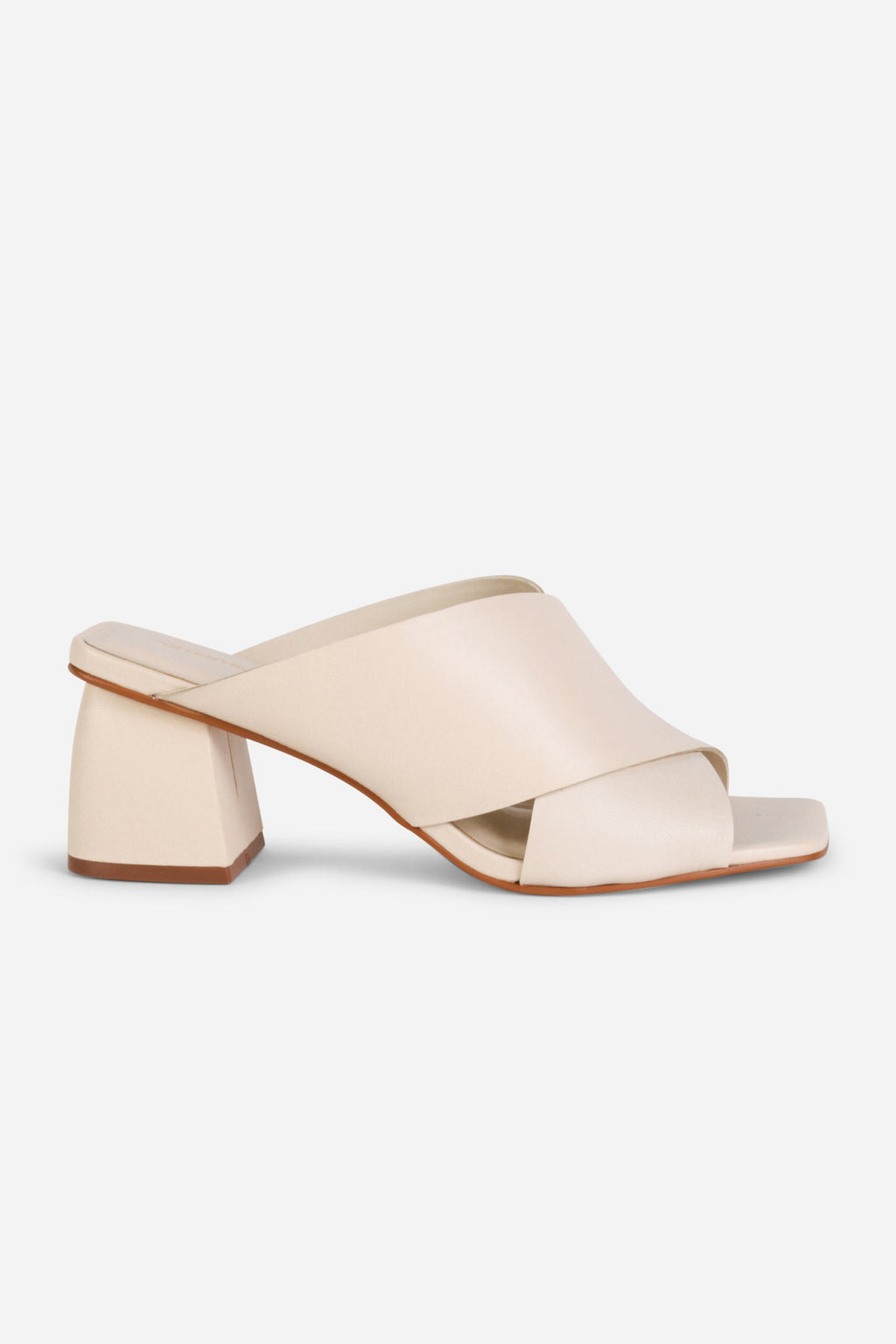 INTENTIONALLY __________. Lefty Mule Heel Sandals