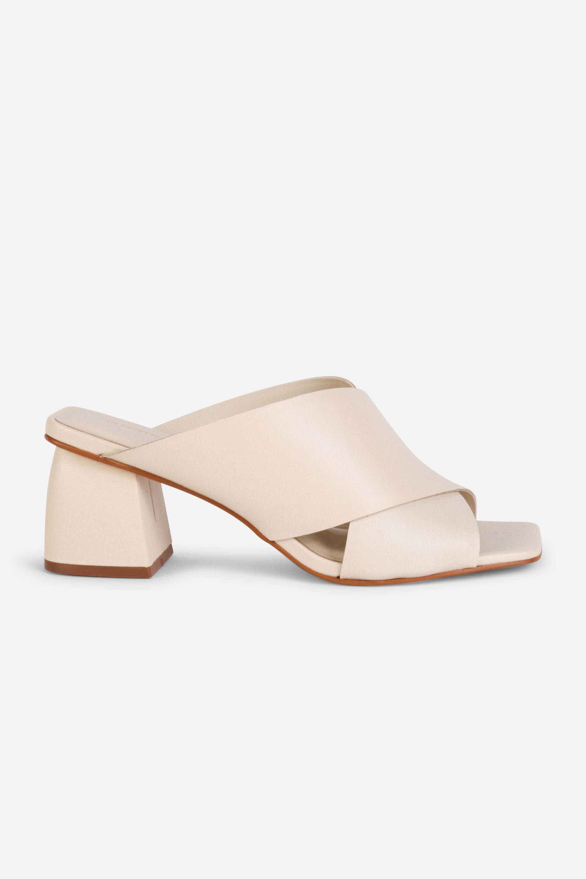 INTENTIONALLY __________. Lefty Mule Heel Sandals