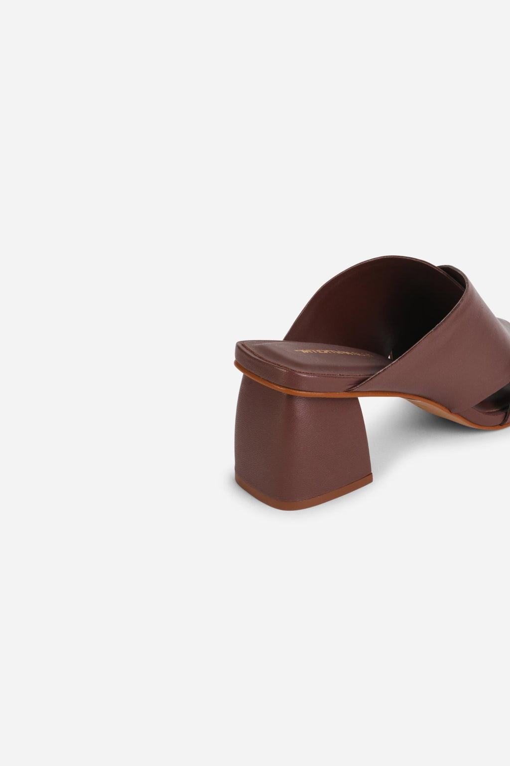 INTENTIONALLY __________. Lefty Mule Heel Sandals