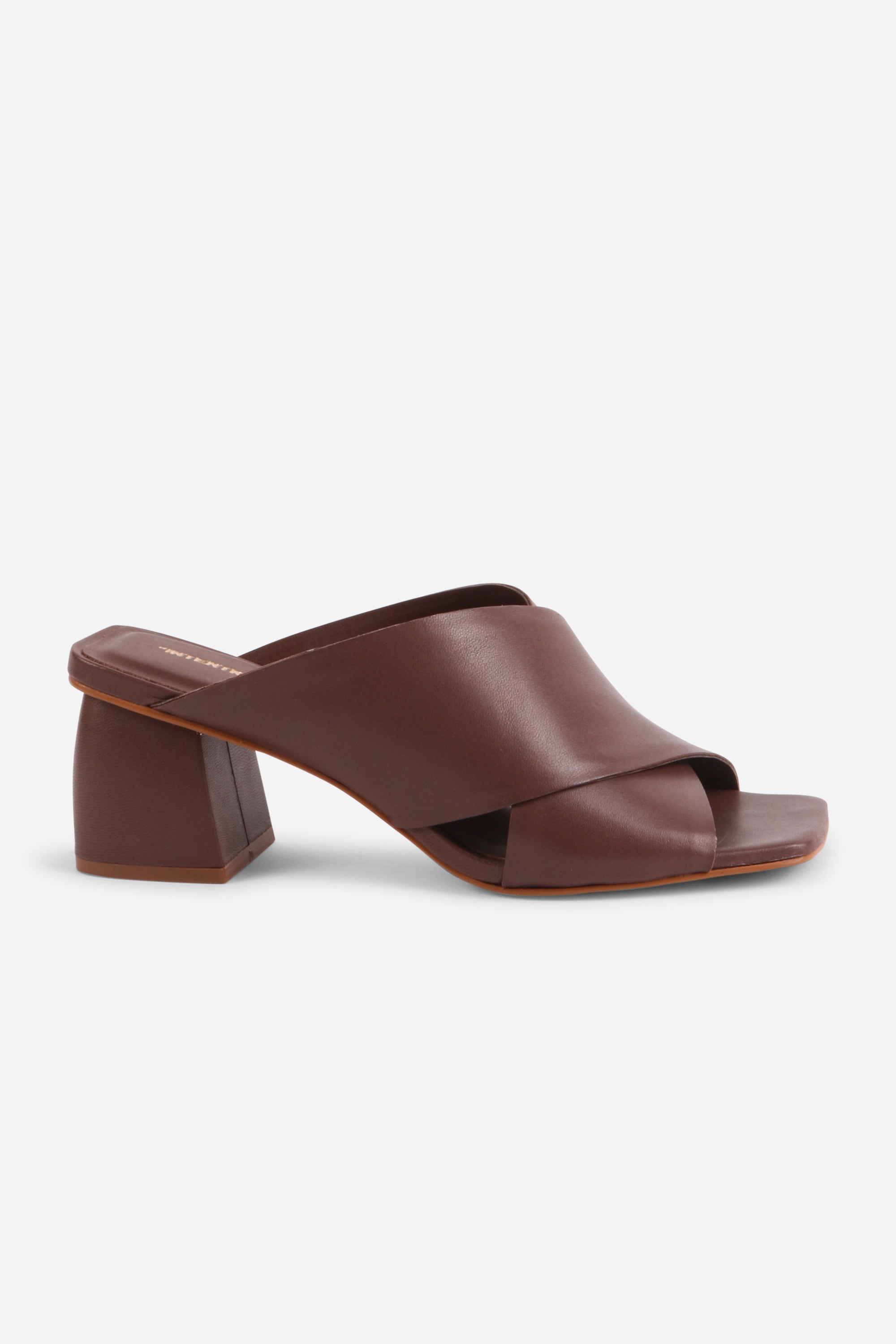 INTENTIONALLY __________. Lefty Mule Heel Sandals