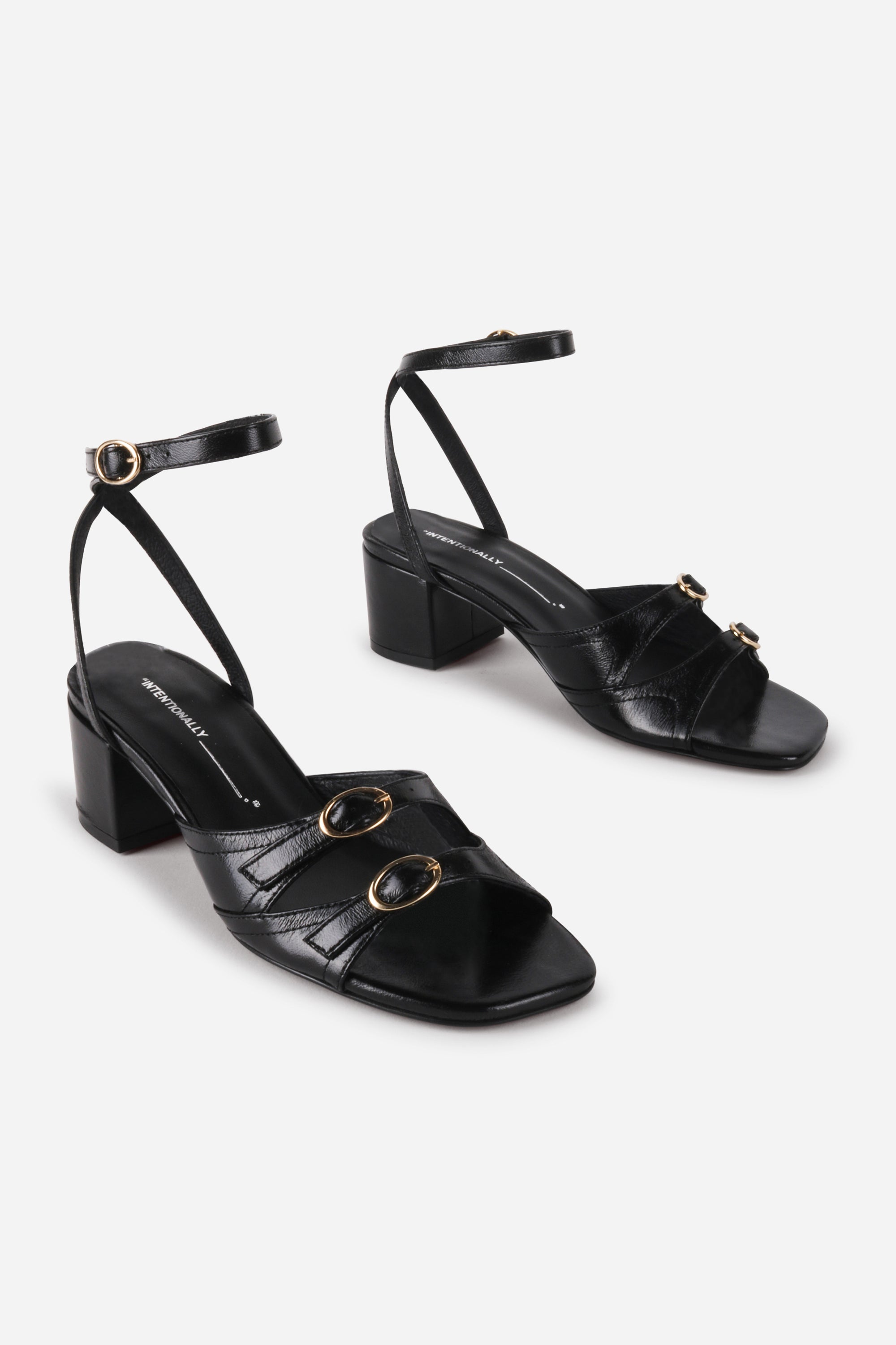 INTENTIONALLY __________. Lingo Block Heel Sandal