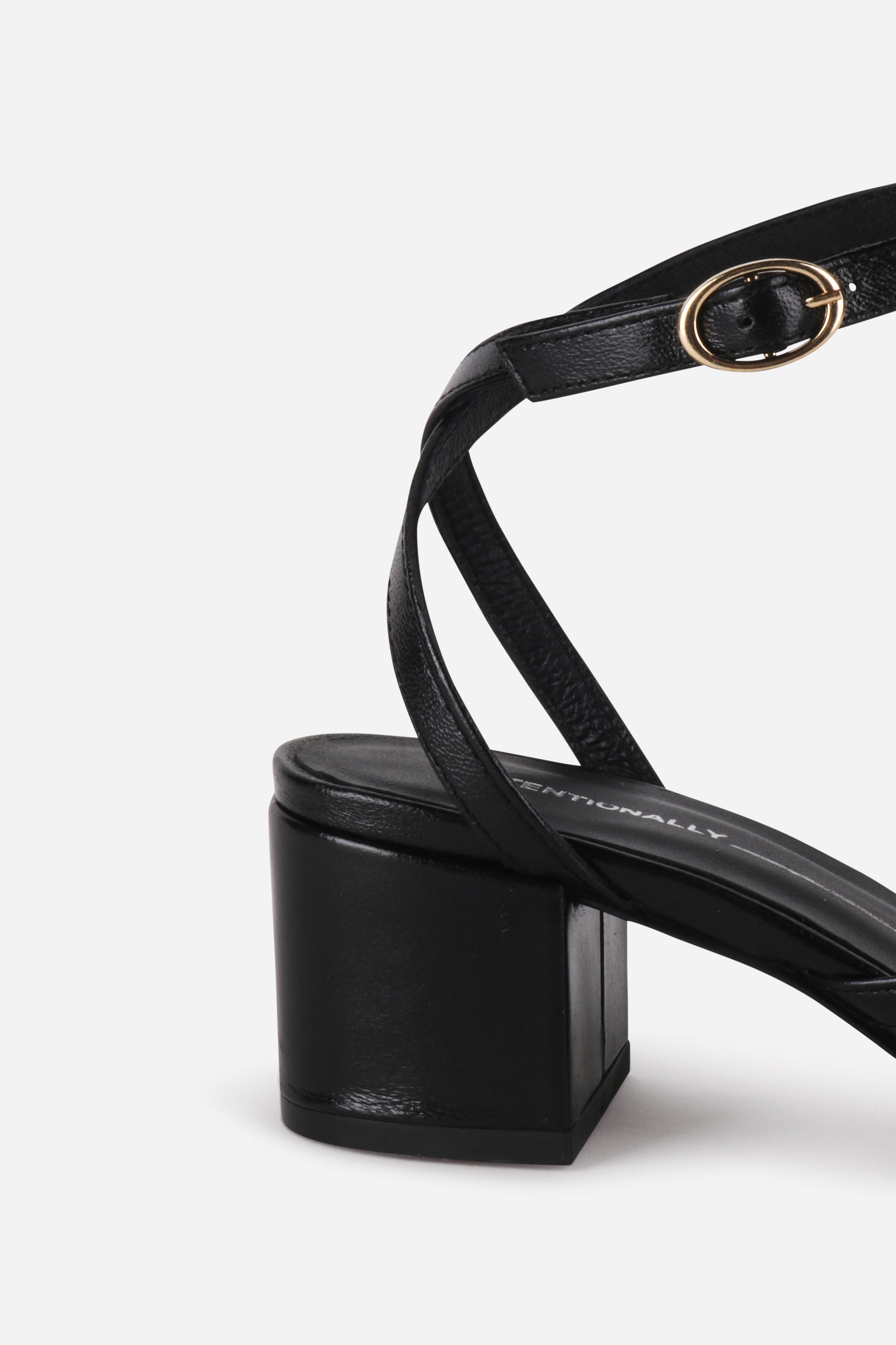 INTENTIONALLY __________. Lingo Block Heel Sandal