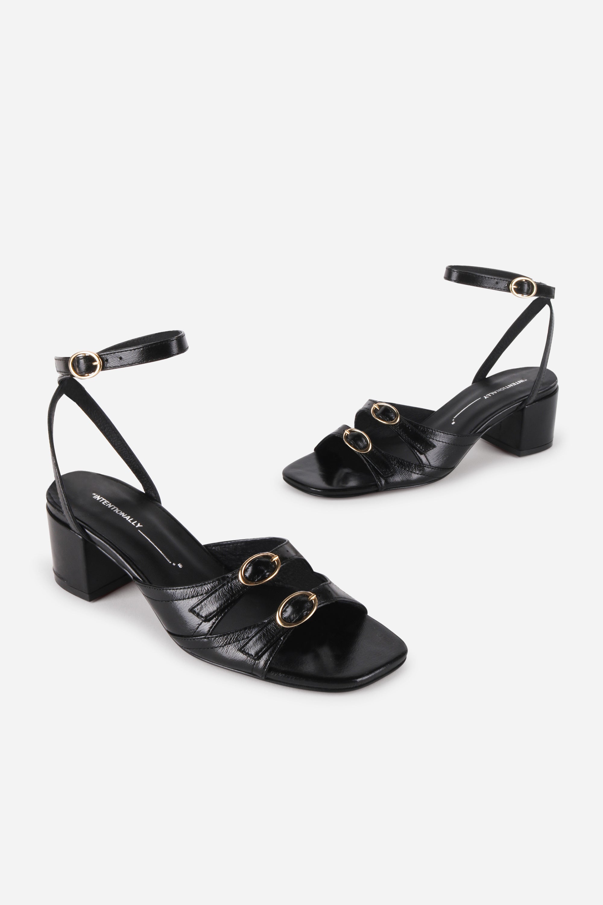 INTENTIONALLY __________. Lingo Block Heel Sandal