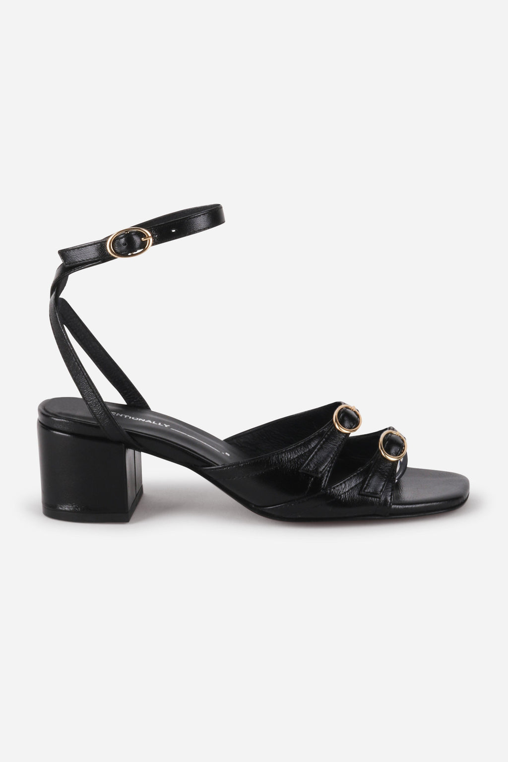 INTENTIONALLY __________. Lingo Block Heel Sandal