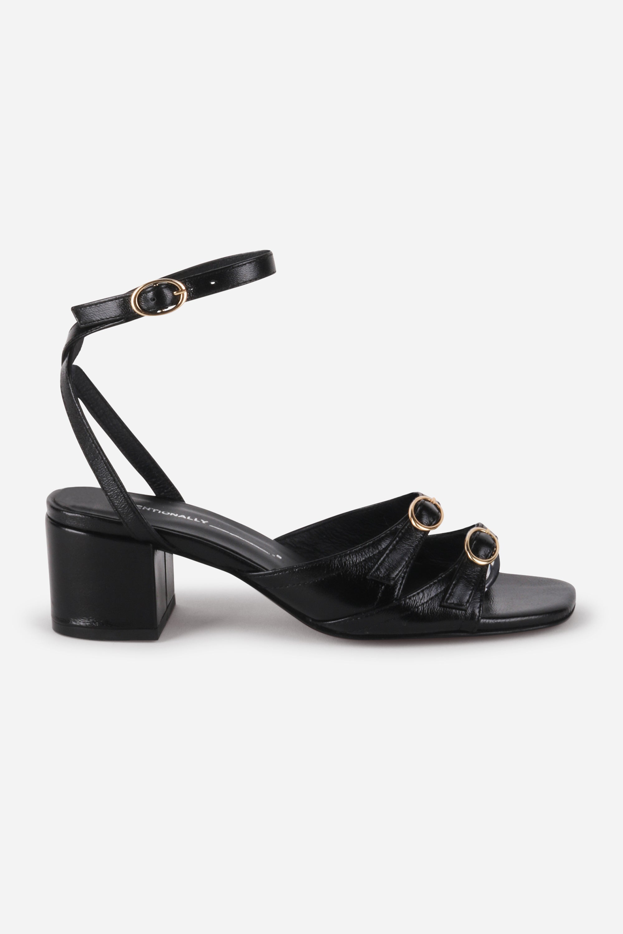 INTENTIONALLY __________. Lingo Block Heel Sandal