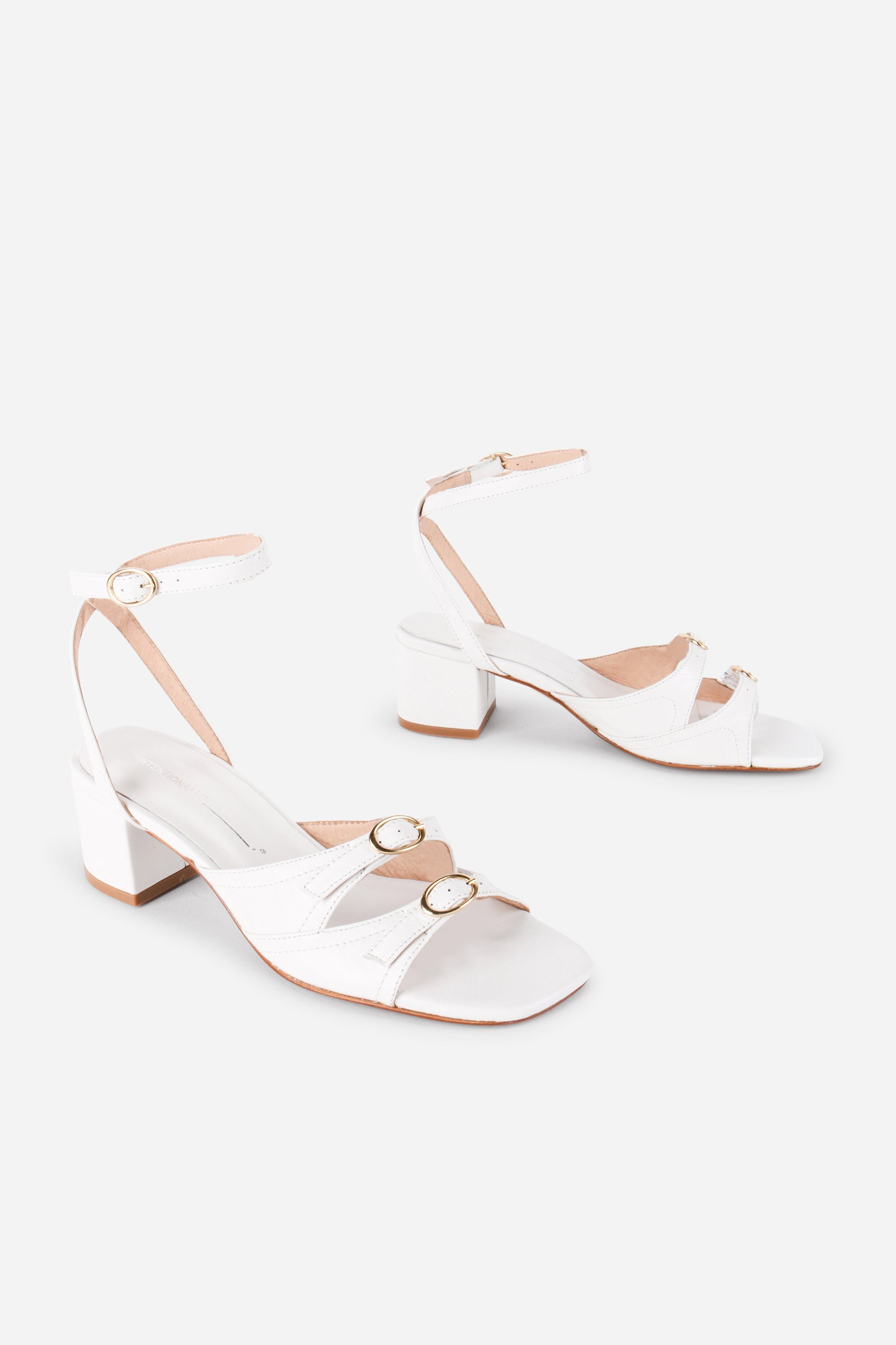 INTENTIONALLY __________. Lingo Block Heel Sandal