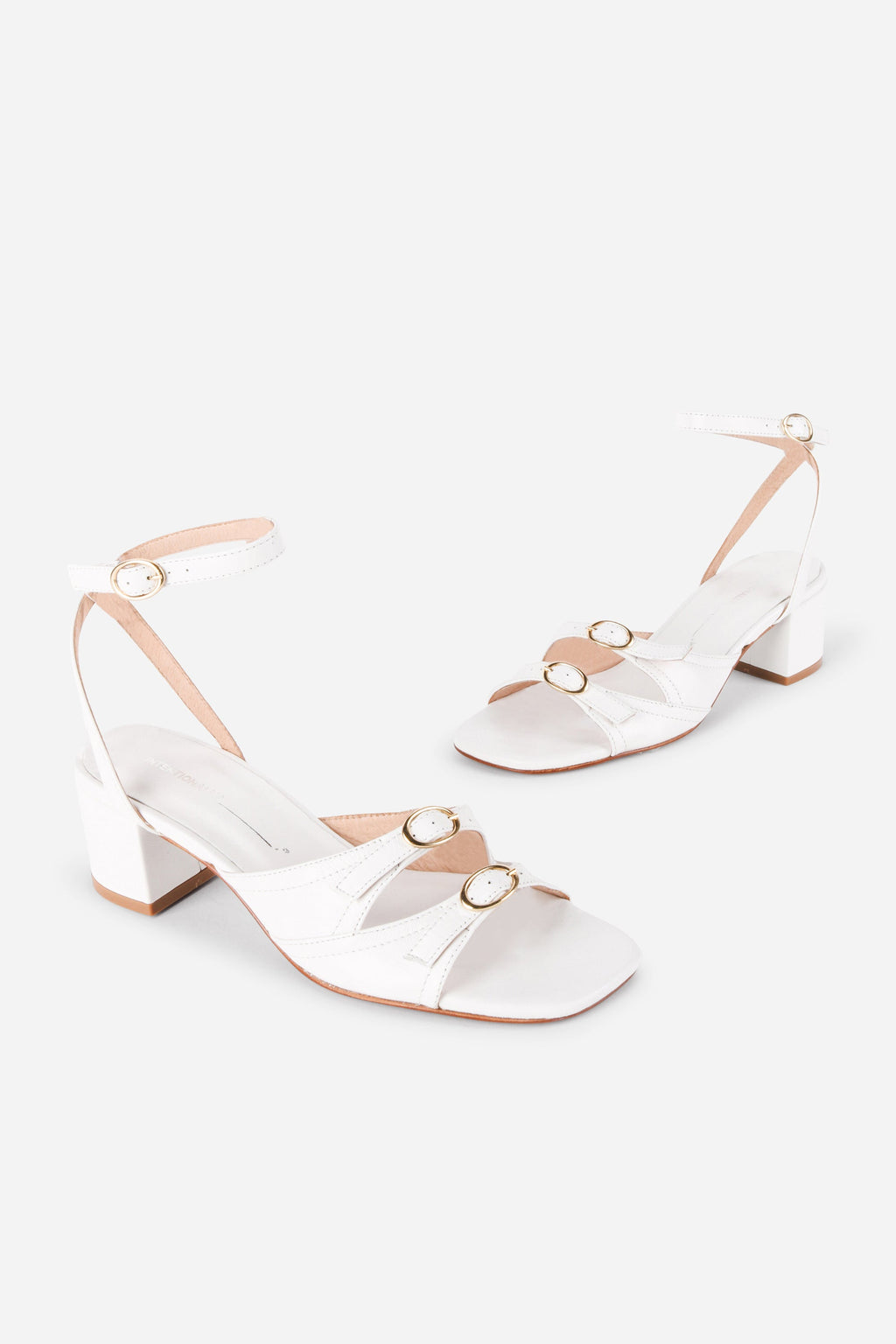 INTENTIONALLY __________. Lingo Block Heel Sandal