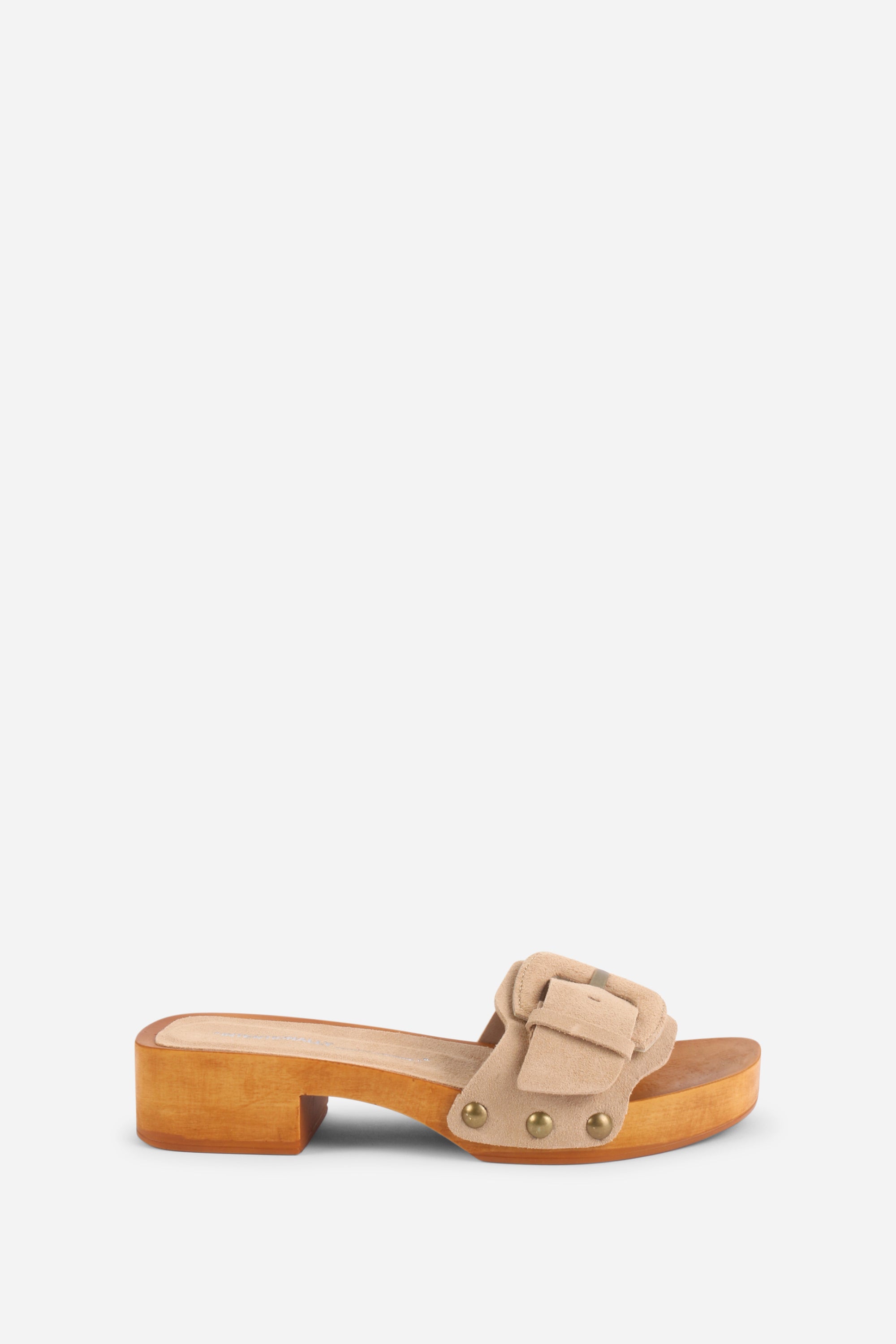 INTENTIONALLY __________. Mar Suede Clog