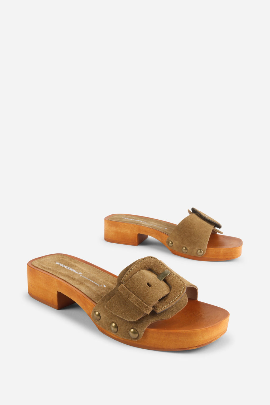 INTENTIONALLY __________. Mar Suede Clog