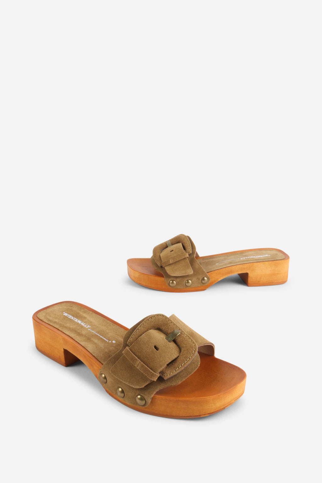 INTENTIONALLY __________. Mar Suede Clog