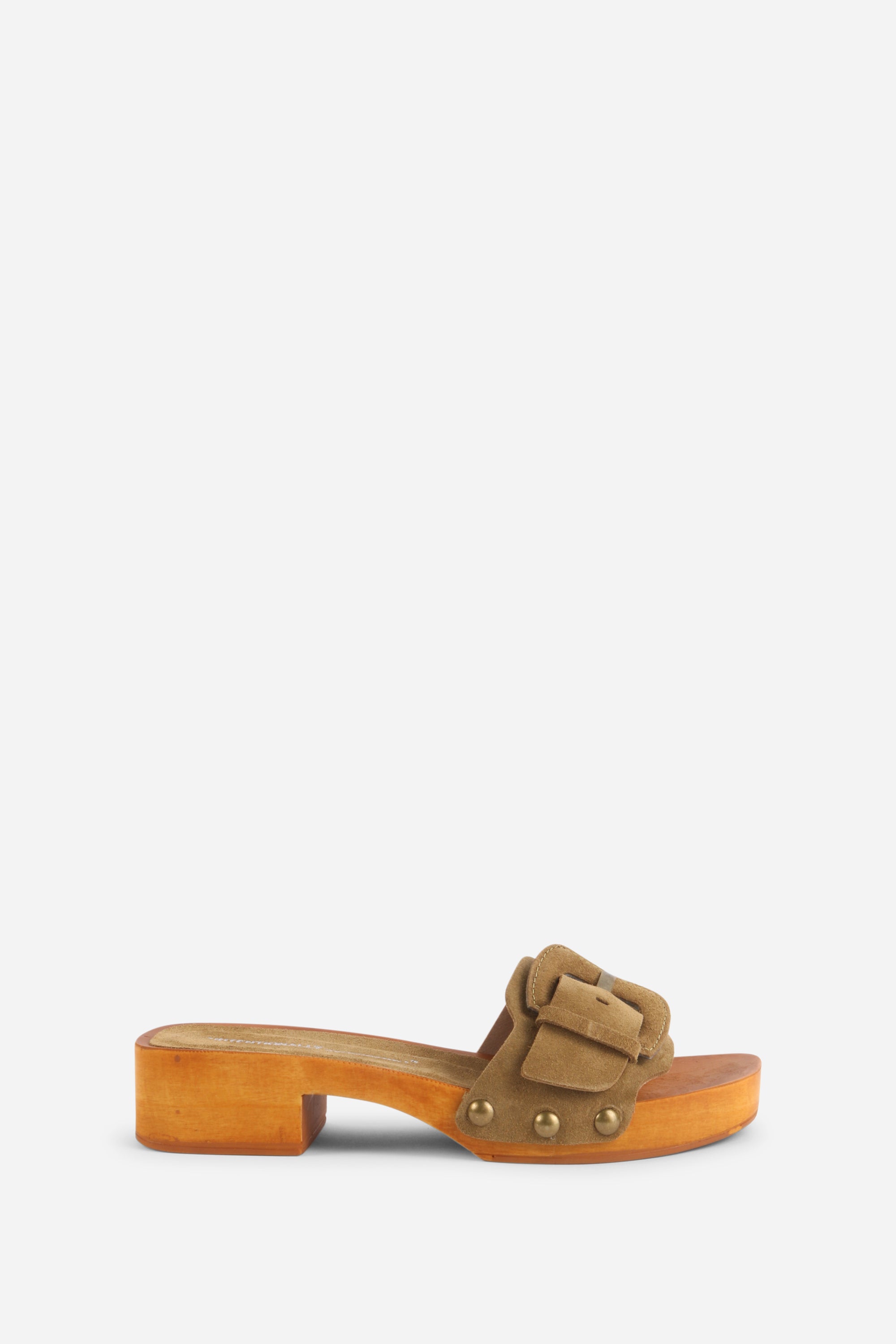 INTENTIONALLY __________. Mar Suede Clog