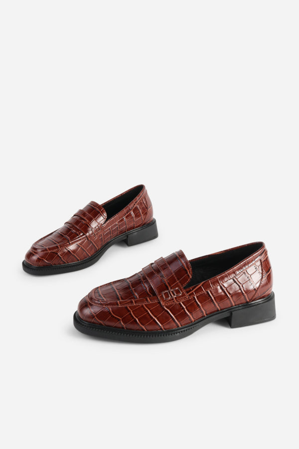 INTENTIONALLY __________. Marblehead Penny Loafer