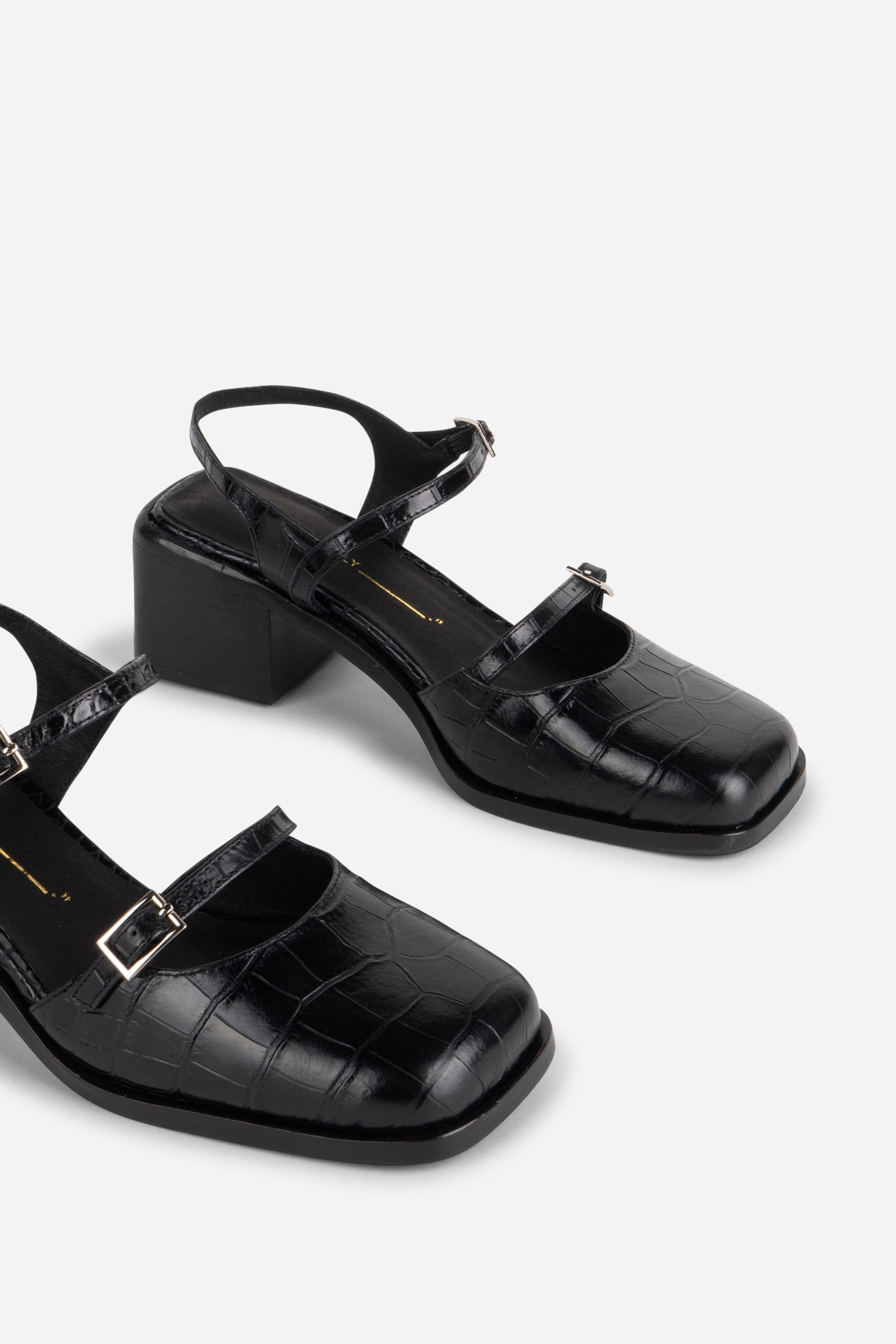 INTENTIONALLY __________. Mitzi Block Heel